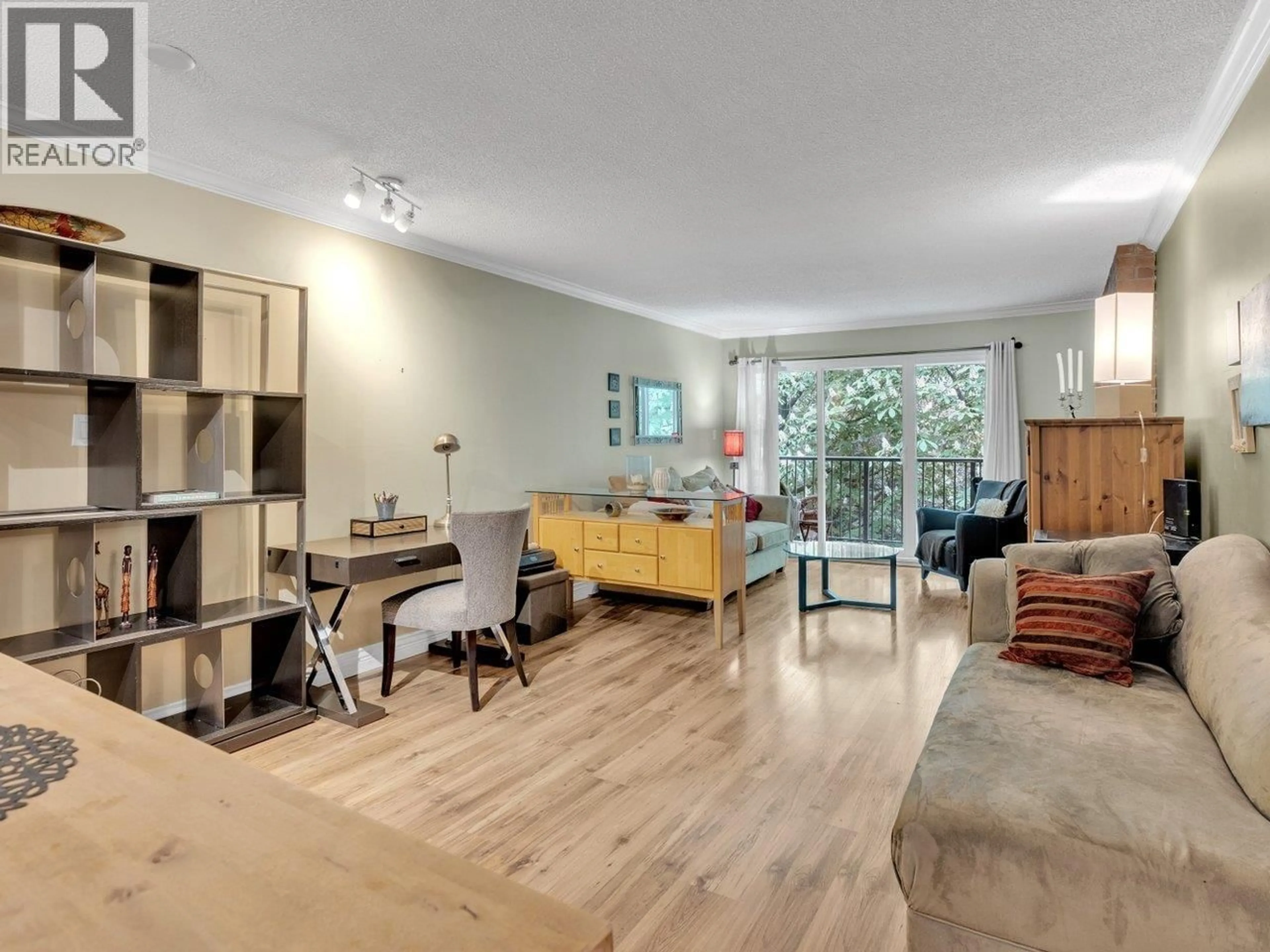 Living room with furniture, wood/laminate floor for 303 - 1234 PENDRELL STREET, Vancouver British Columbia V6E1L6