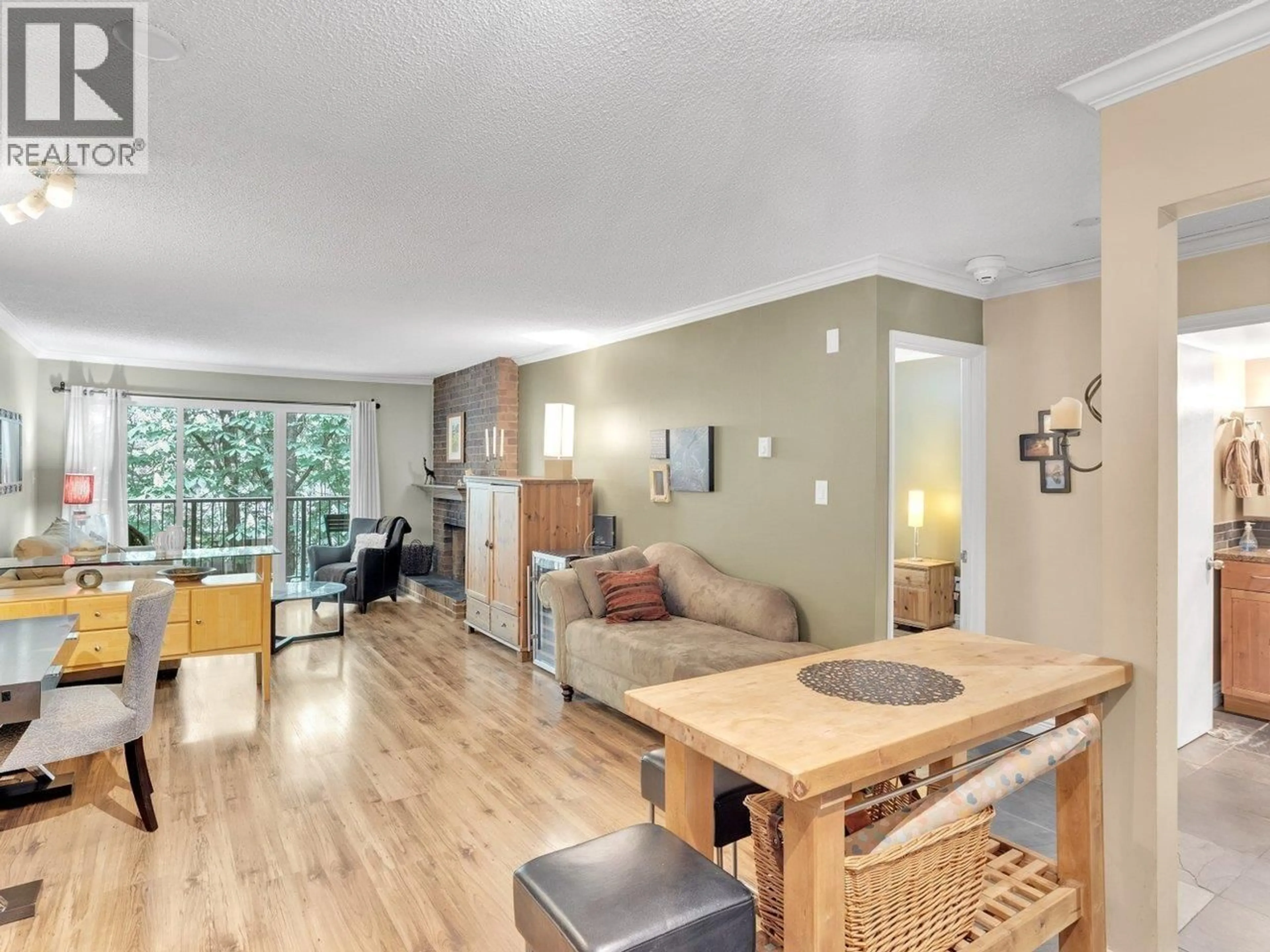 Living room with furniture, wood/laminate floor for 303 - 1234 PENDRELL STREET, Vancouver British Columbia V6E1L6