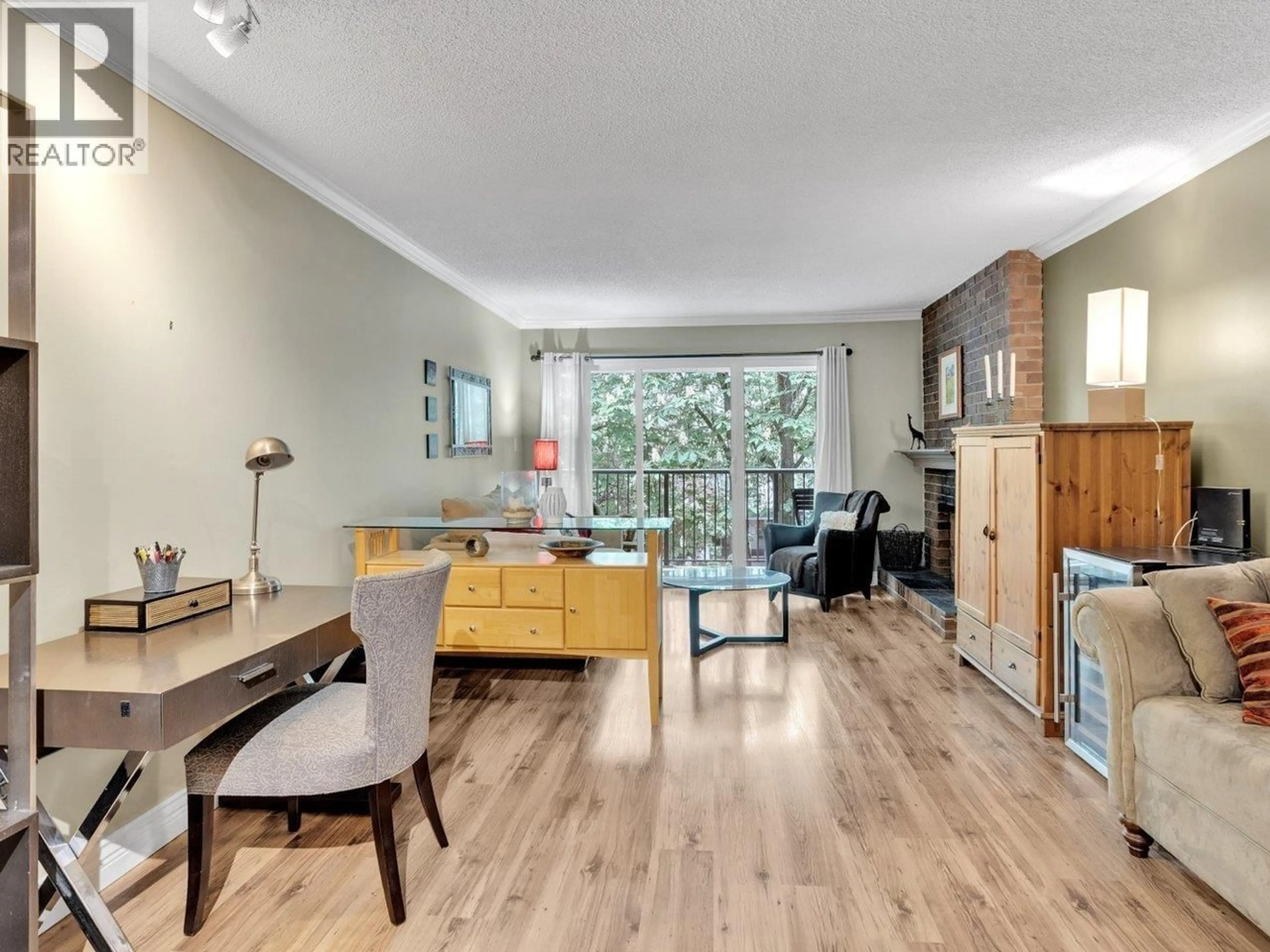 Living room with furniture, wood/laminate floor for 303 - 1234 PENDRELL STREET, Vancouver British Columbia V6E1L6