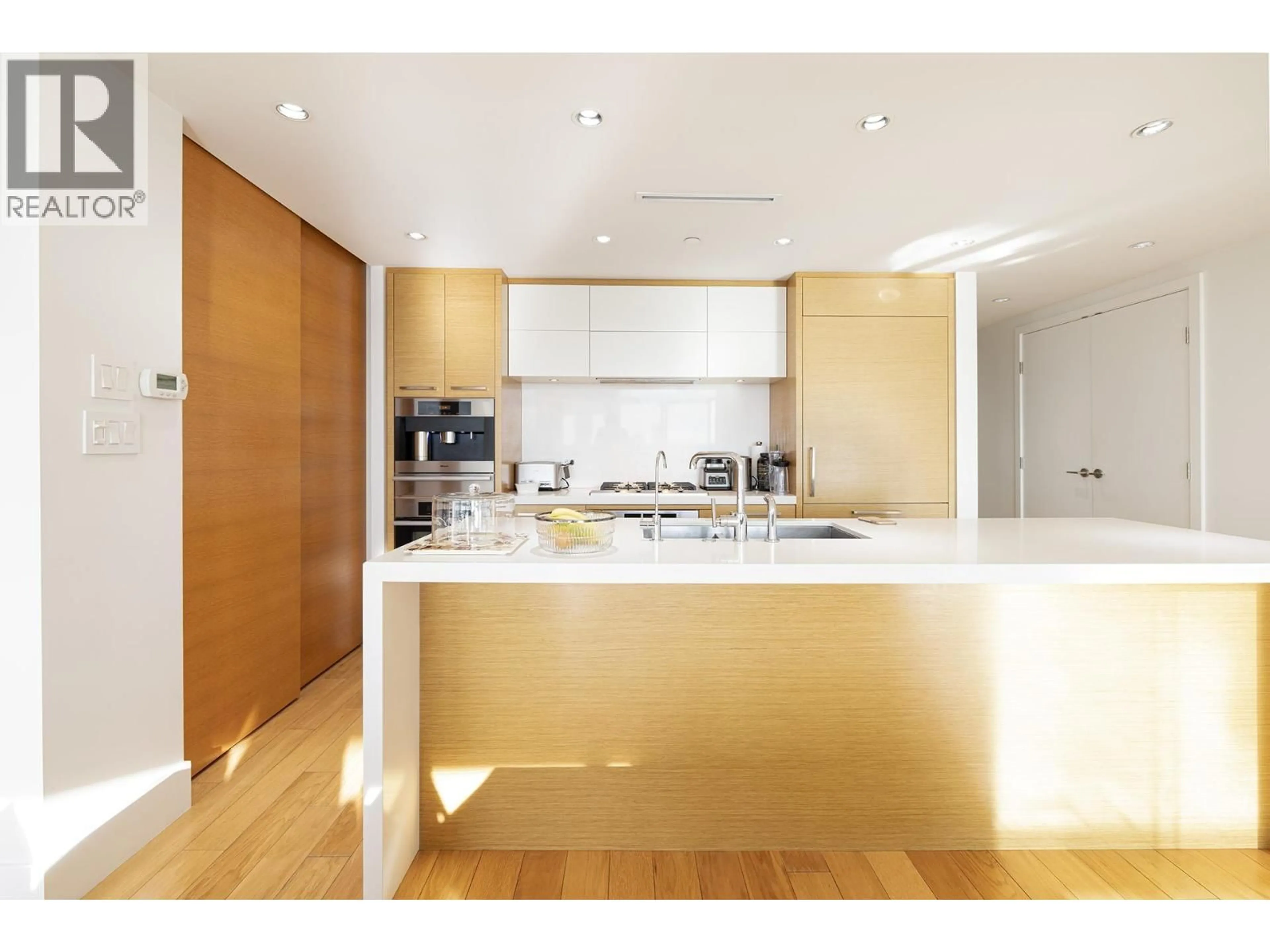 Contemporary kitchen, wood/laminate floor for 3001 - 667 HOWE STREET, Vancouver British Columbia V6C0B5