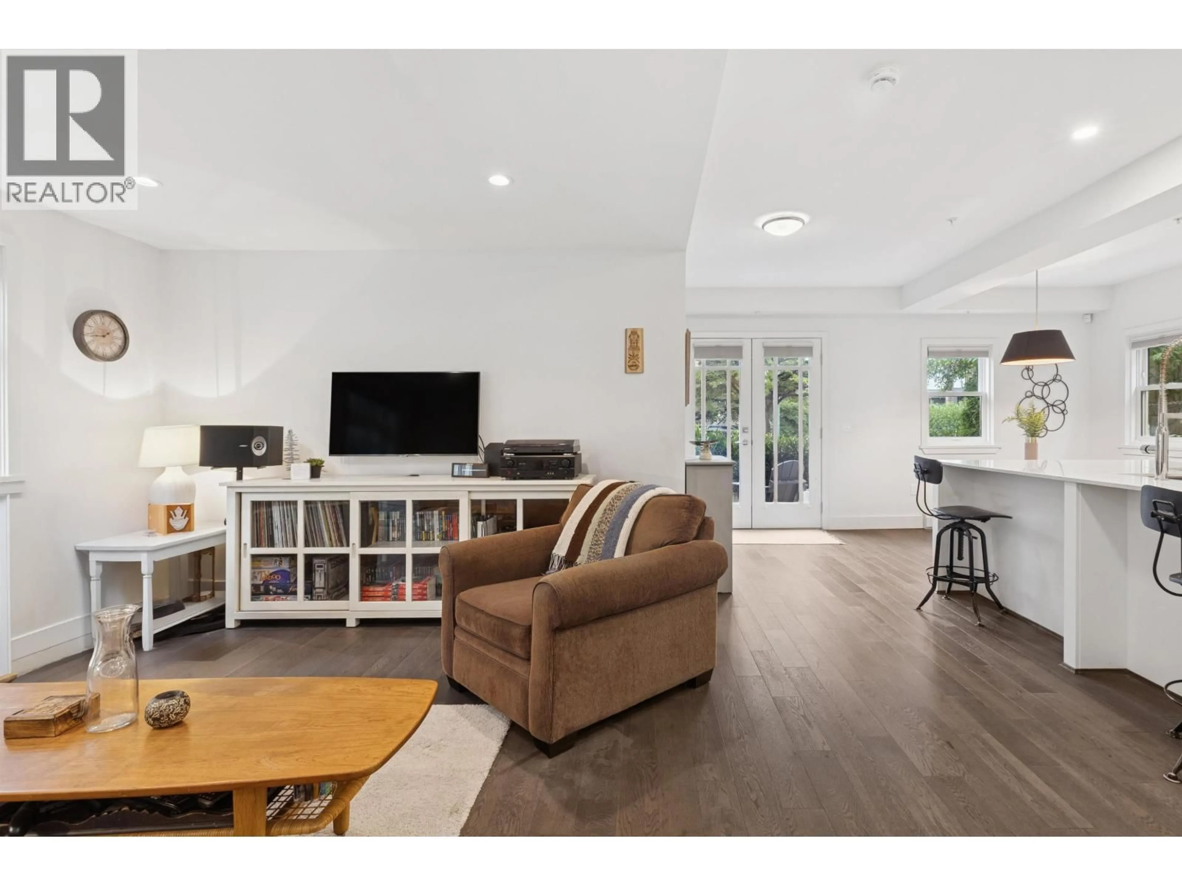 Living room with furniture, wood/laminate floor for 2 - 244 5TH STREET, North Vancouver British Columbia V7L1L7