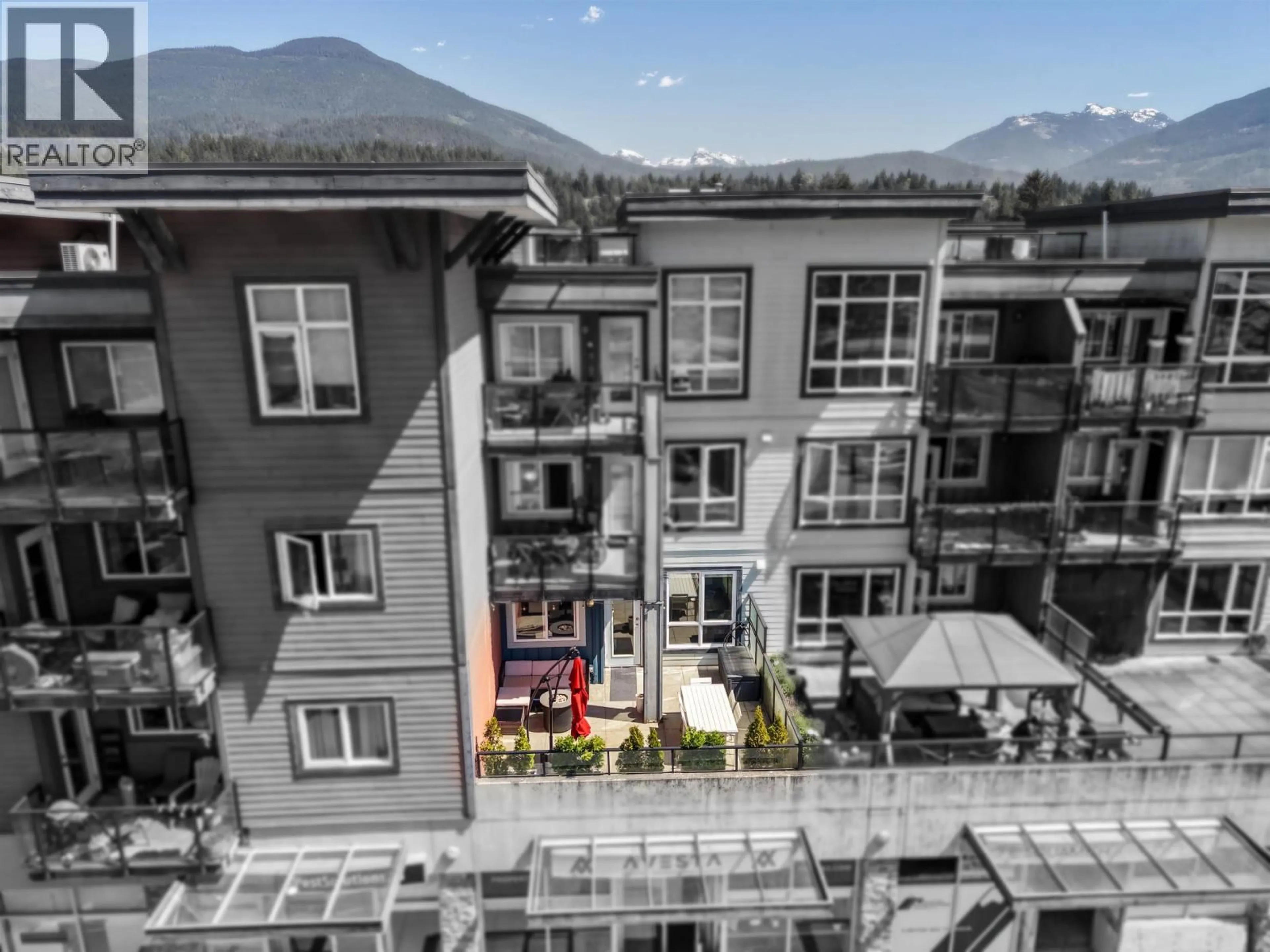 A pic from outside/outdoor area/front of a property/back of a property/a pic from drone, mountain view for 220 - 40437 TANTALUS ROAD, Squamish British Columbia V0N1T0