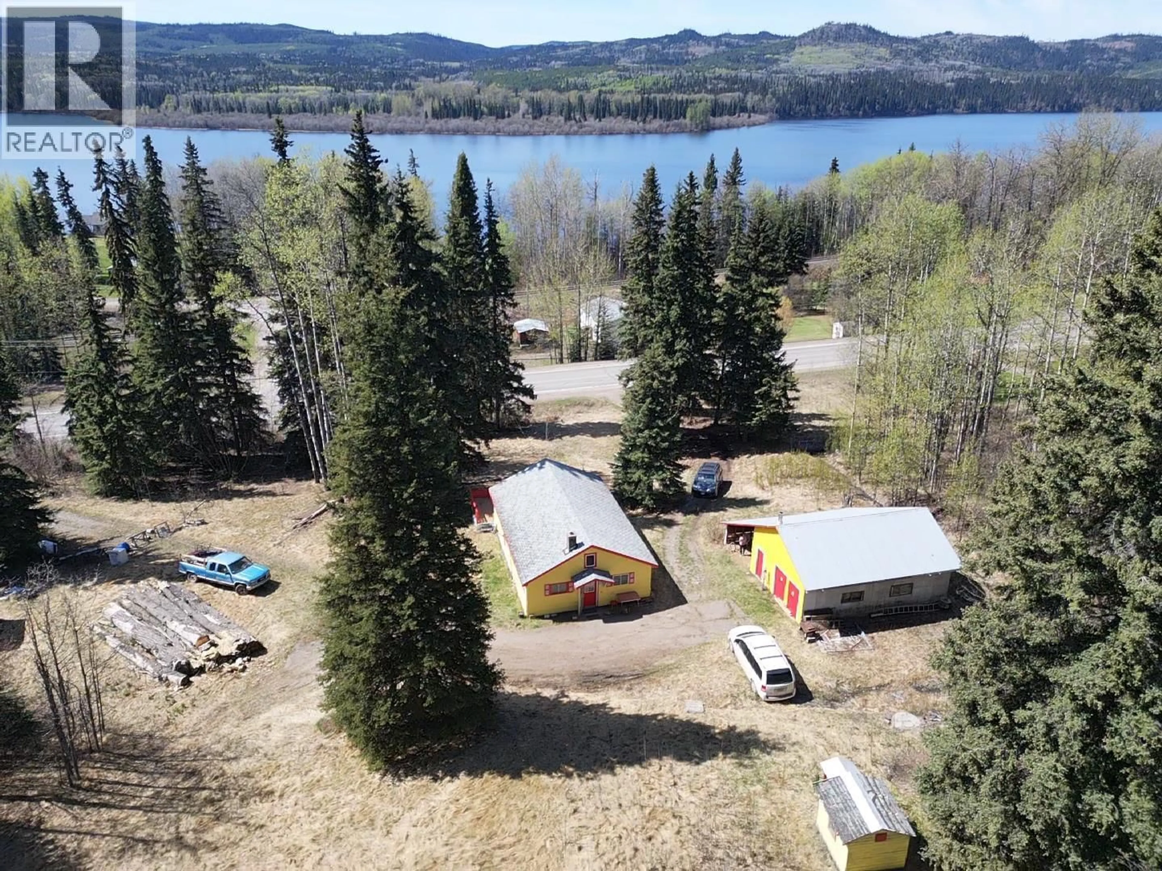 A pic from outside/outdoor area/front of a property/back of a property/a pic from drone, water/lake/river/ocean view for 10258 W 16 HIGHWAY, Burns Lake British Columbia V0J1E1
