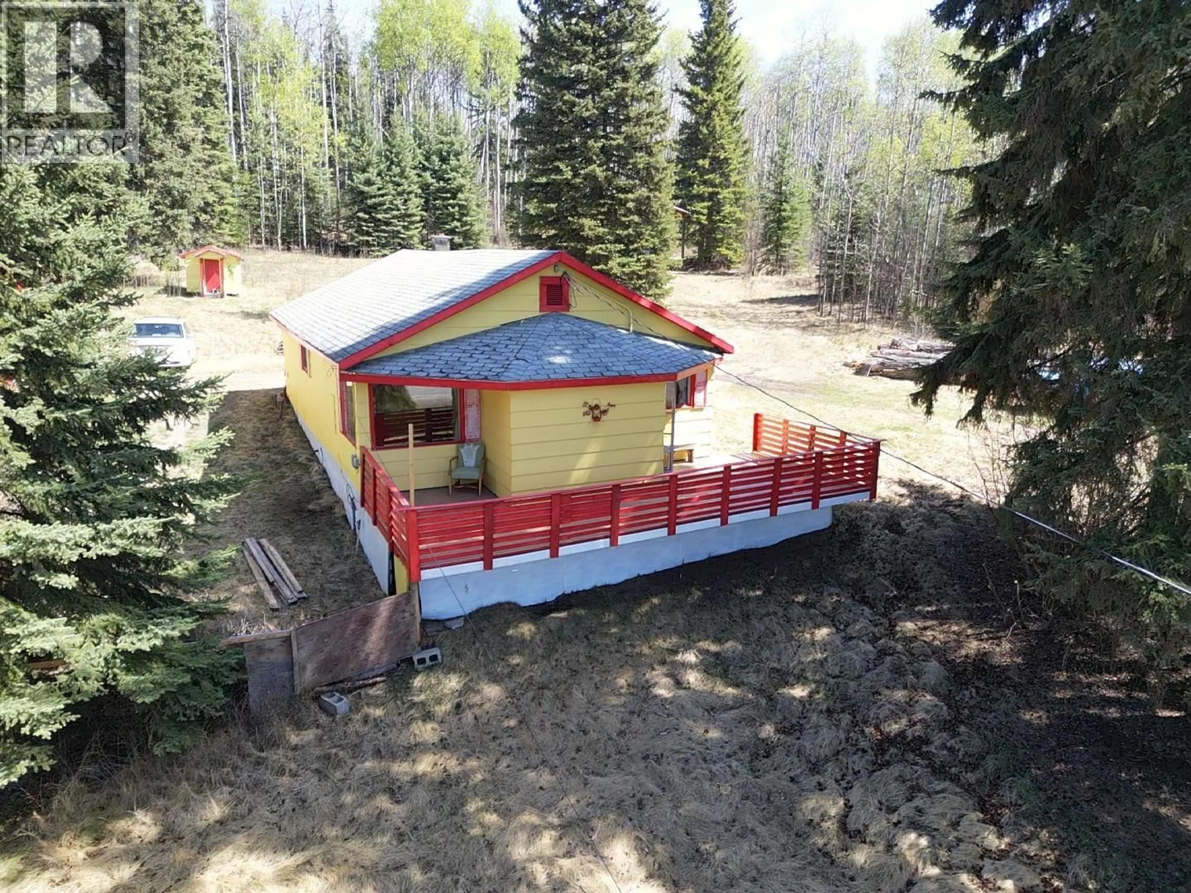 A pic from outside/outdoor area/front of a property/back of a property/a pic from drone, forest/trees view for 10258 W 16 HIGHWAY, Burns Lake British Columbia V0J1E1