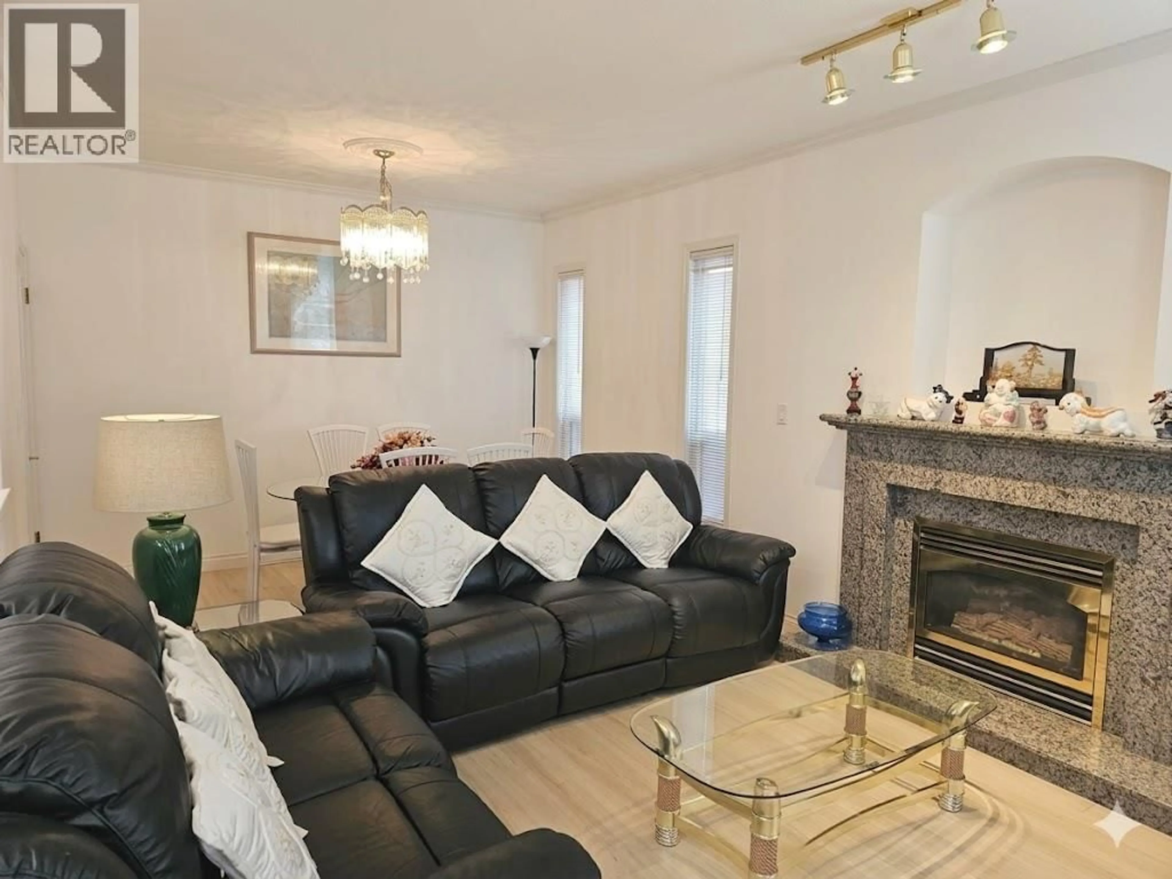 Living room with furniture, wood/laminate floor for 6 - 8693 NO. 3 ROAD, Richmond British Columbia V6Y2E6