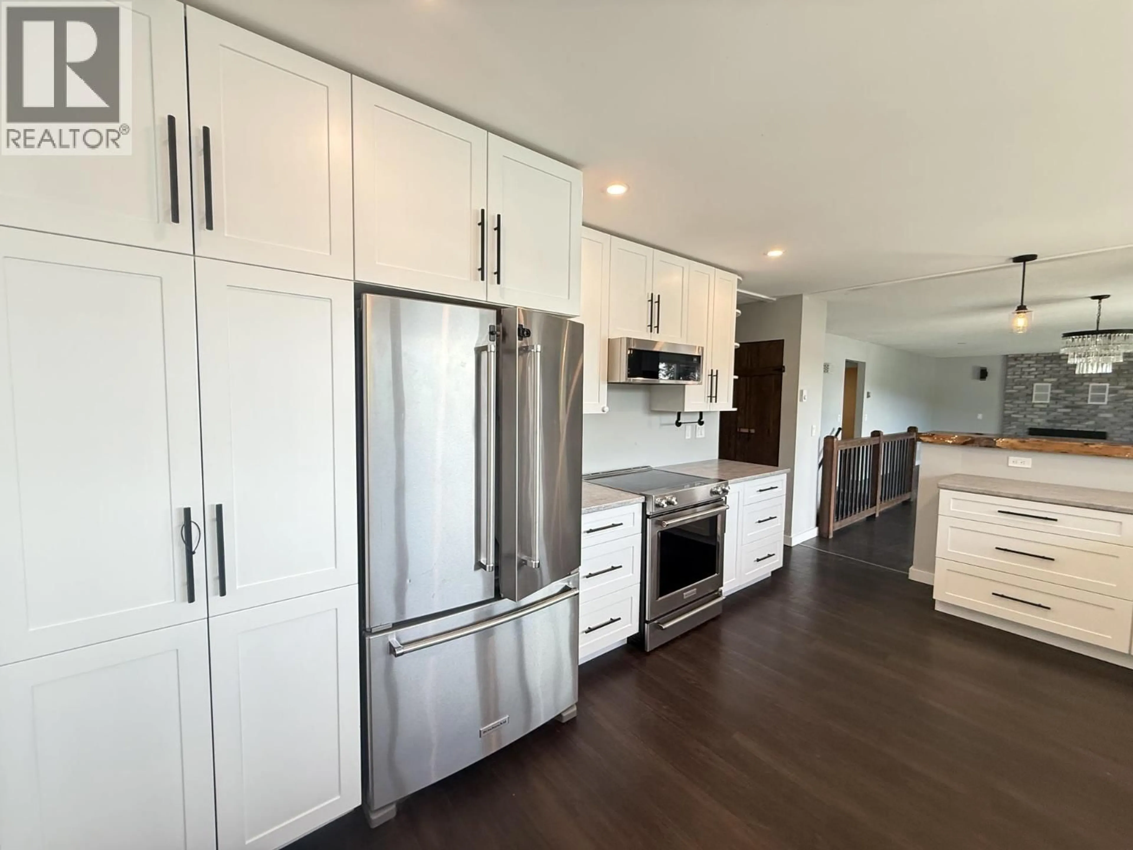 Open concept kitchen, wood/laminate floor for 2412 BELLEVUE DRIVE, Williams Lake British Columbia V2G5H2