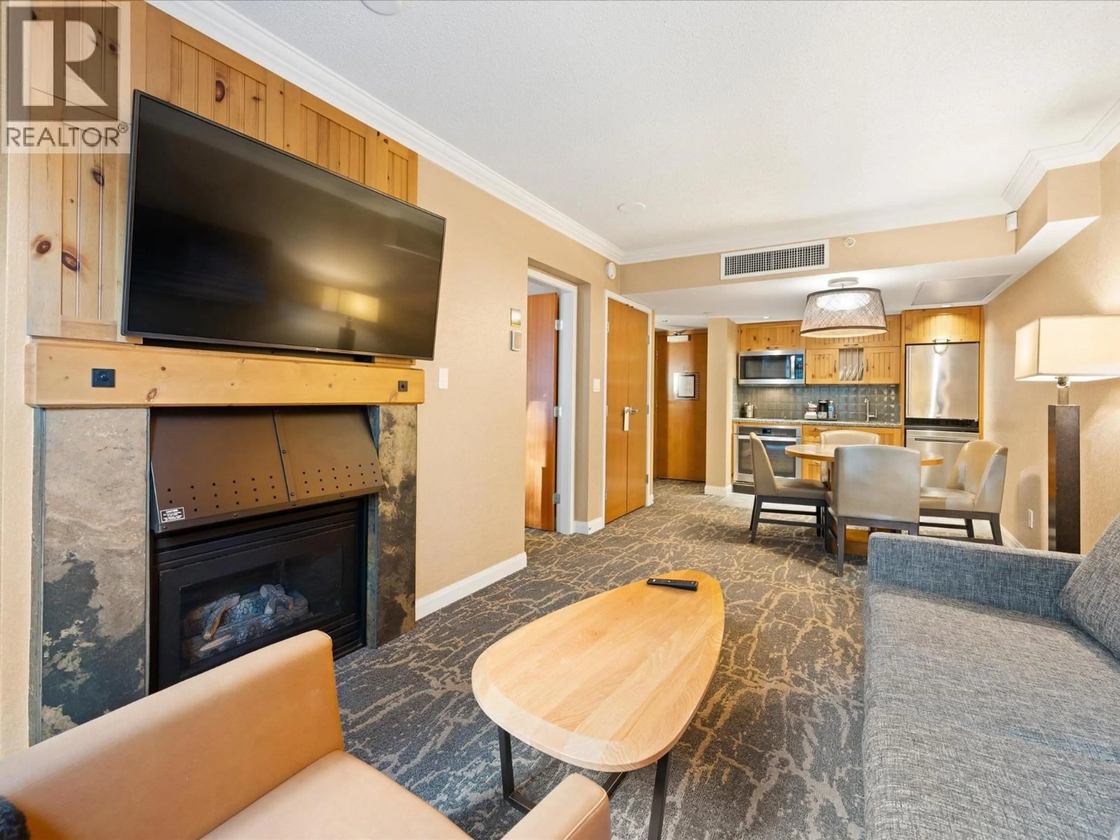 Living room with furniture, wood/laminate floor for 972 - 4090 WHISTLER WAY, Whistler British Columbia V8E1J3