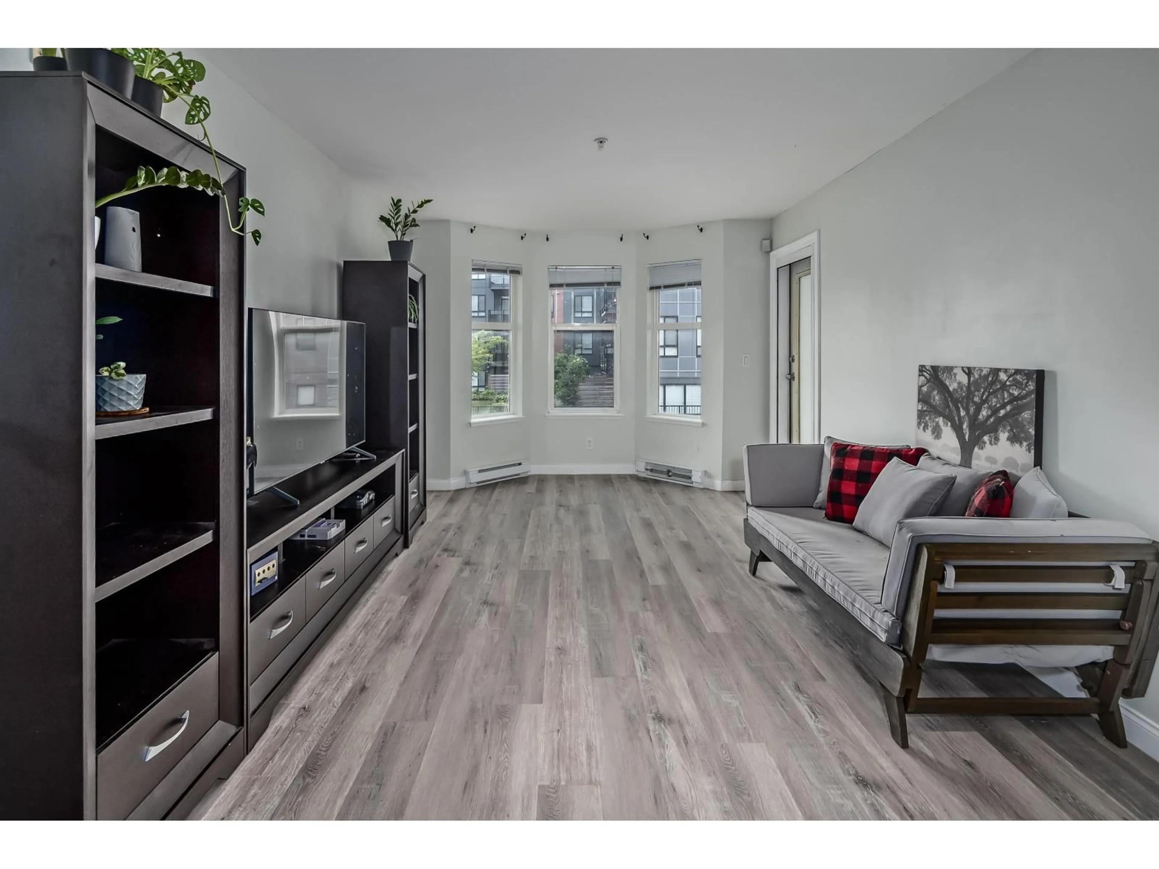 Living room with furniture, wood/laminate floor for 213 - 5438 198 STREET, Langley British Columbia V3A1G2