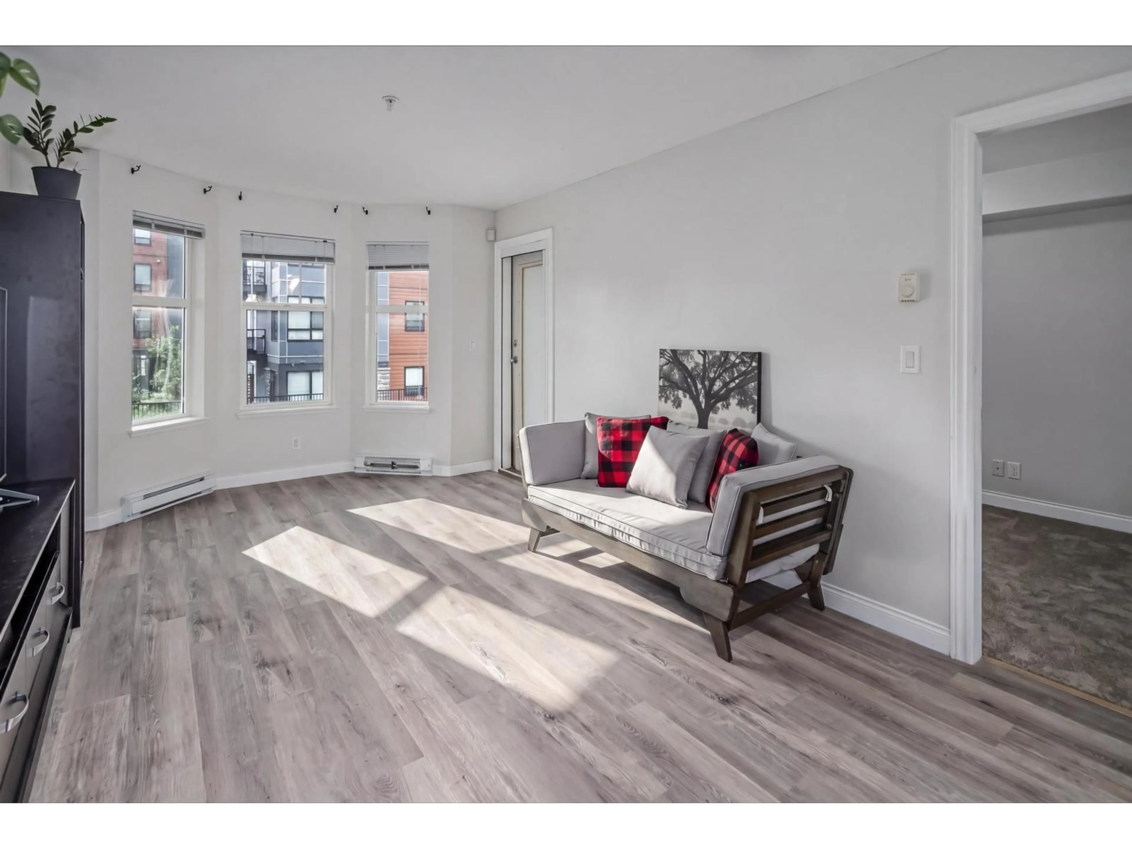 Living room with furniture, wood/laminate floor for 213 - 5438 198 STREET, Langley British Columbia V3A1G2