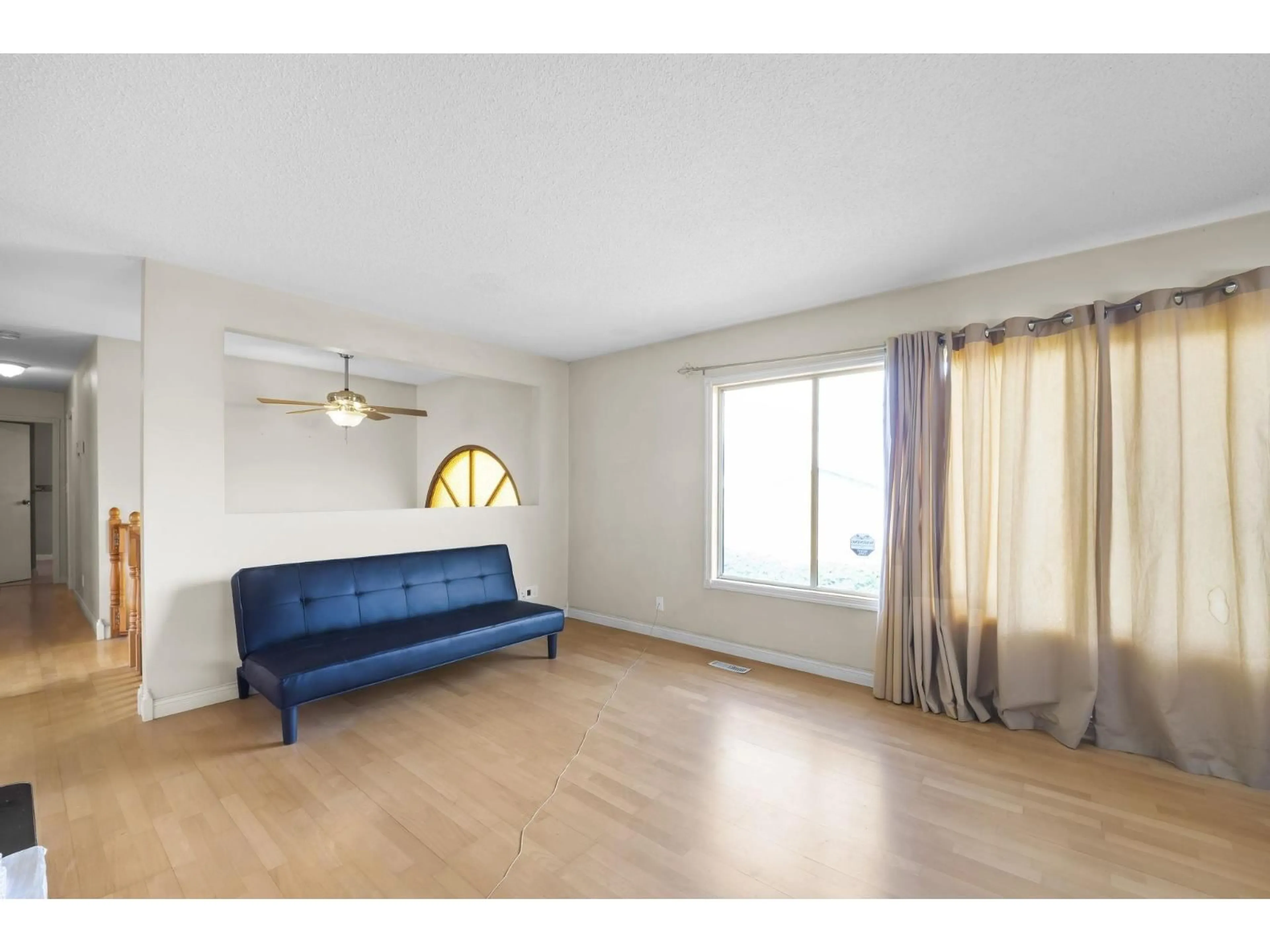Living room with furniture, wood/laminate floor for 41588 YARROW CENTRAL ROAD, Yarrow British Columbia V2R5G4