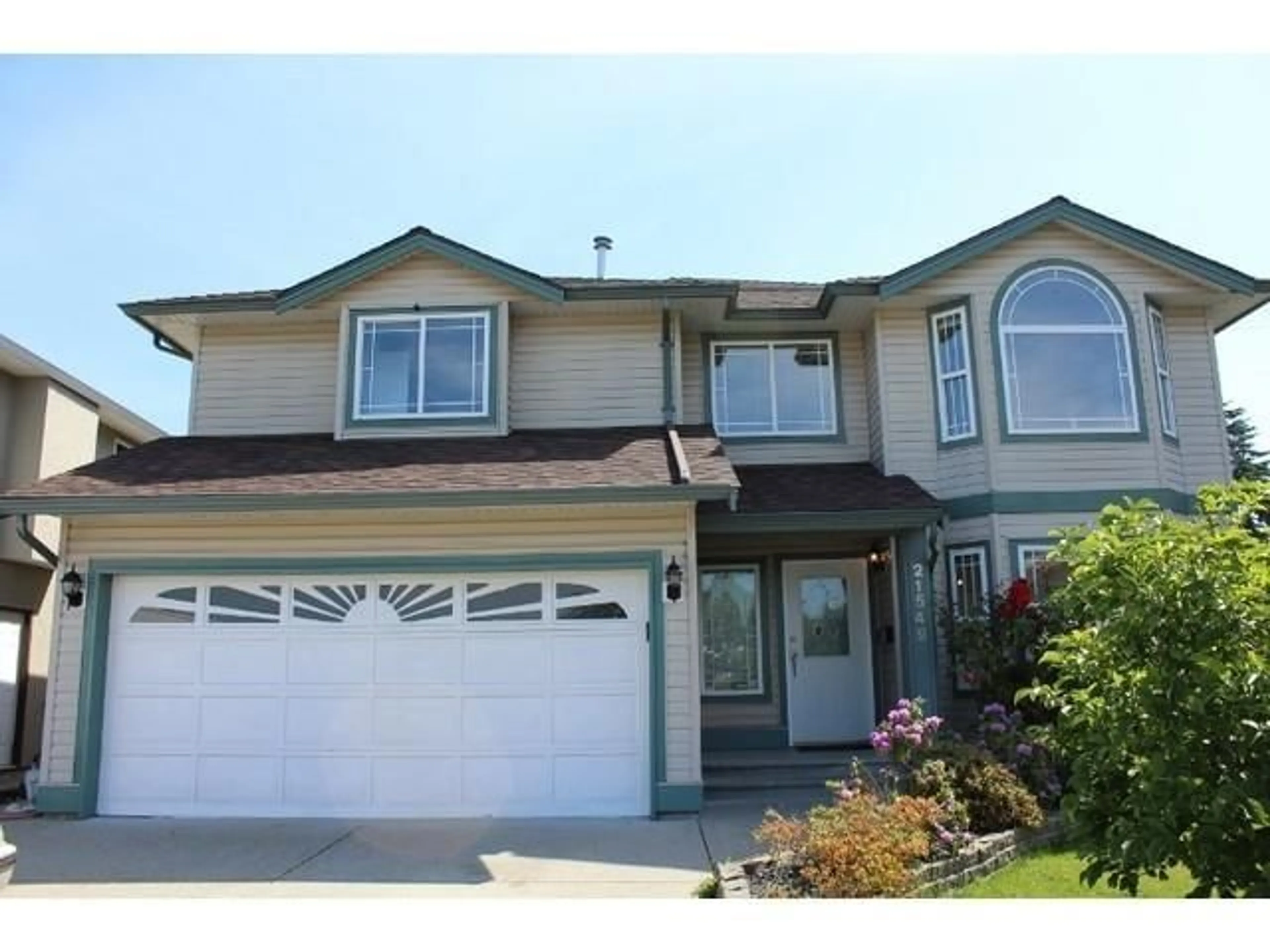 Home with vinyl exterior material, street for 21549 50A AVENUE, Langley British Columbia V3A8W4