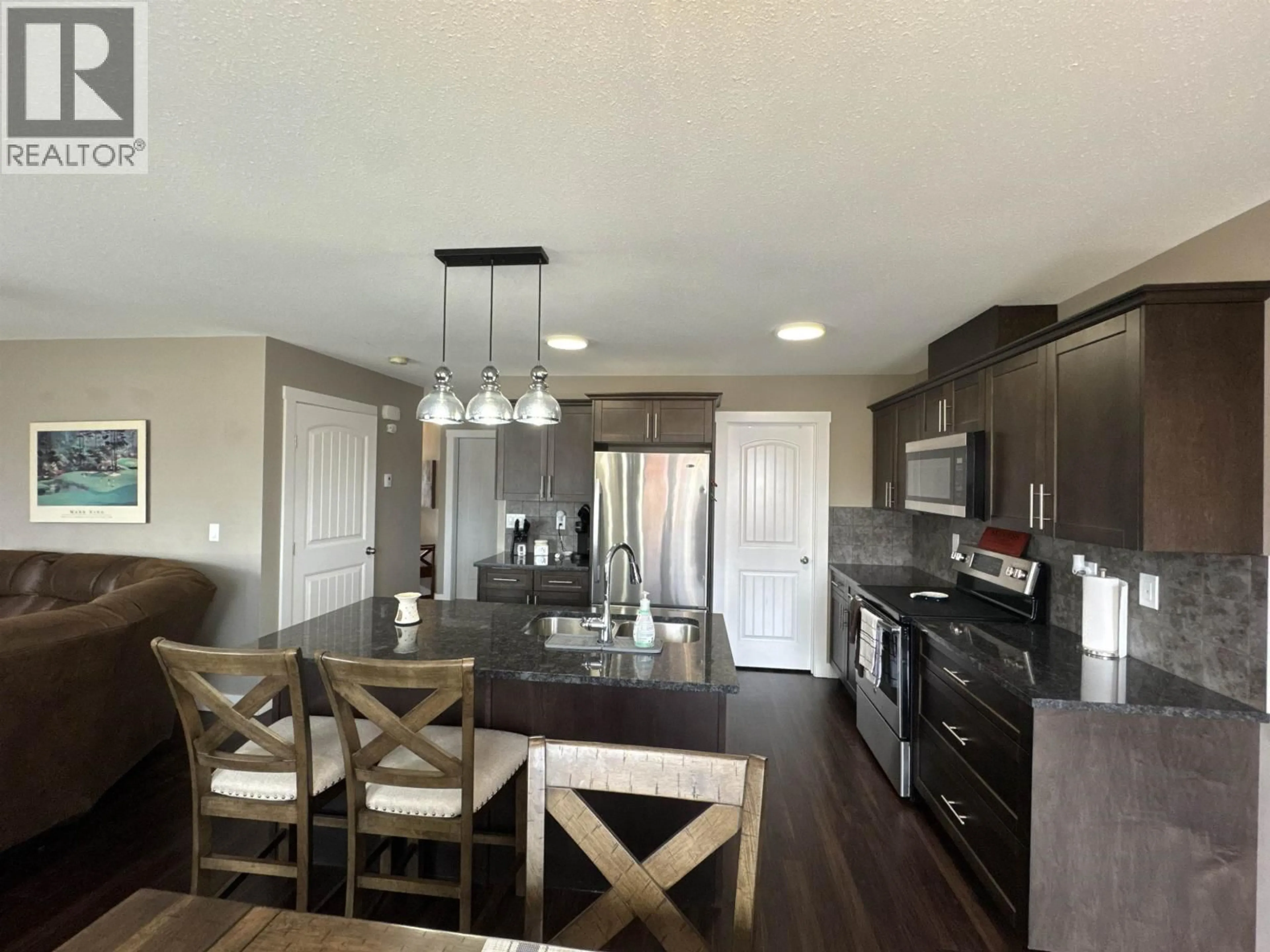 Open concept kitchen, unknown for 109 - 10104 114A AVENUE, Fort St. John British Columbia V1J0K5