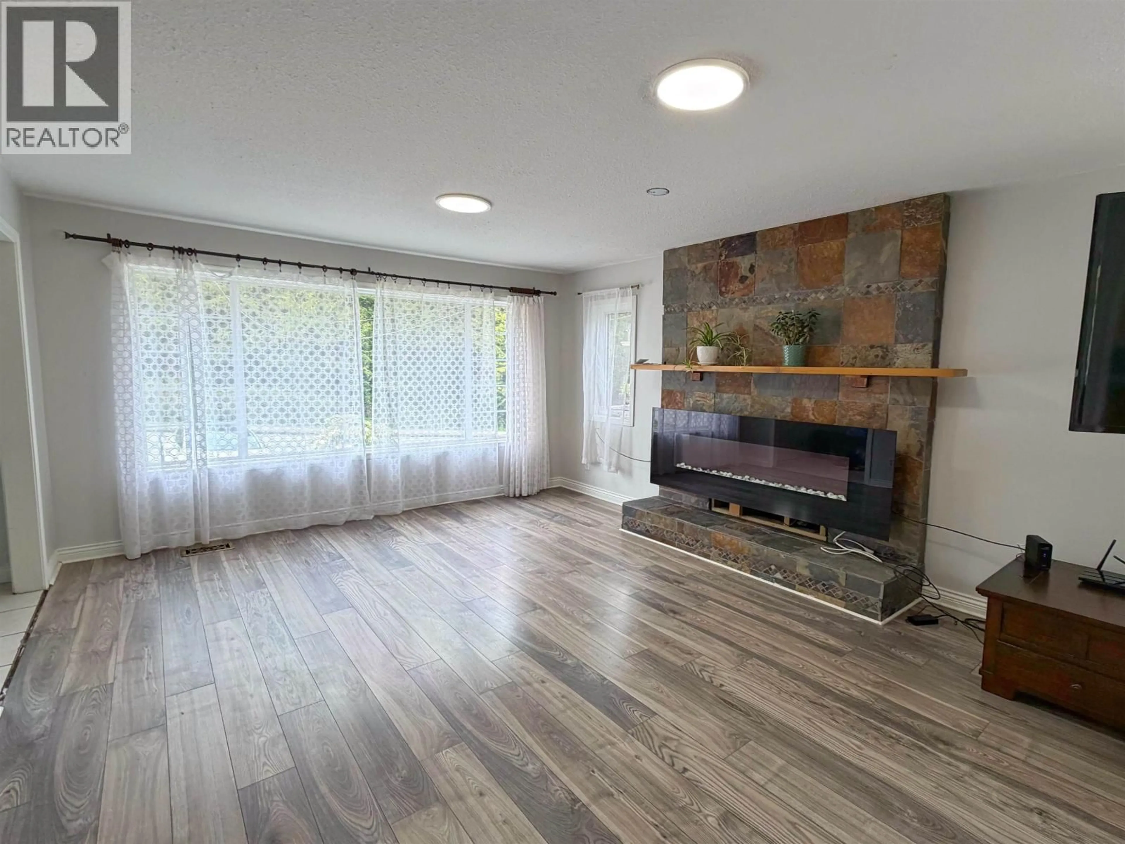 Living room with furniture, wood/laminate floor for 718 11TH AVENUE, Prince Rupert British Columbia V8J2W5