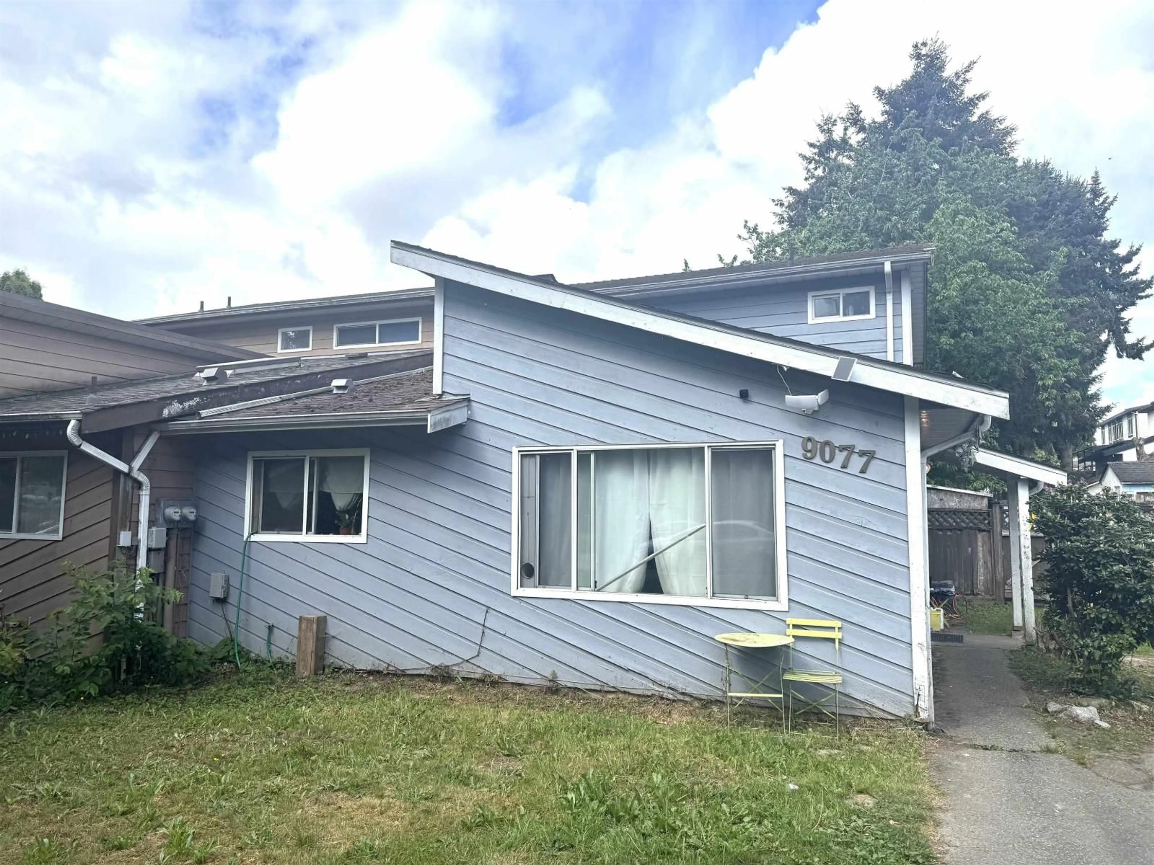 Home with vinyl exterior material, street for 9077 135A STREET, Surrey British Columbia V3V7C4