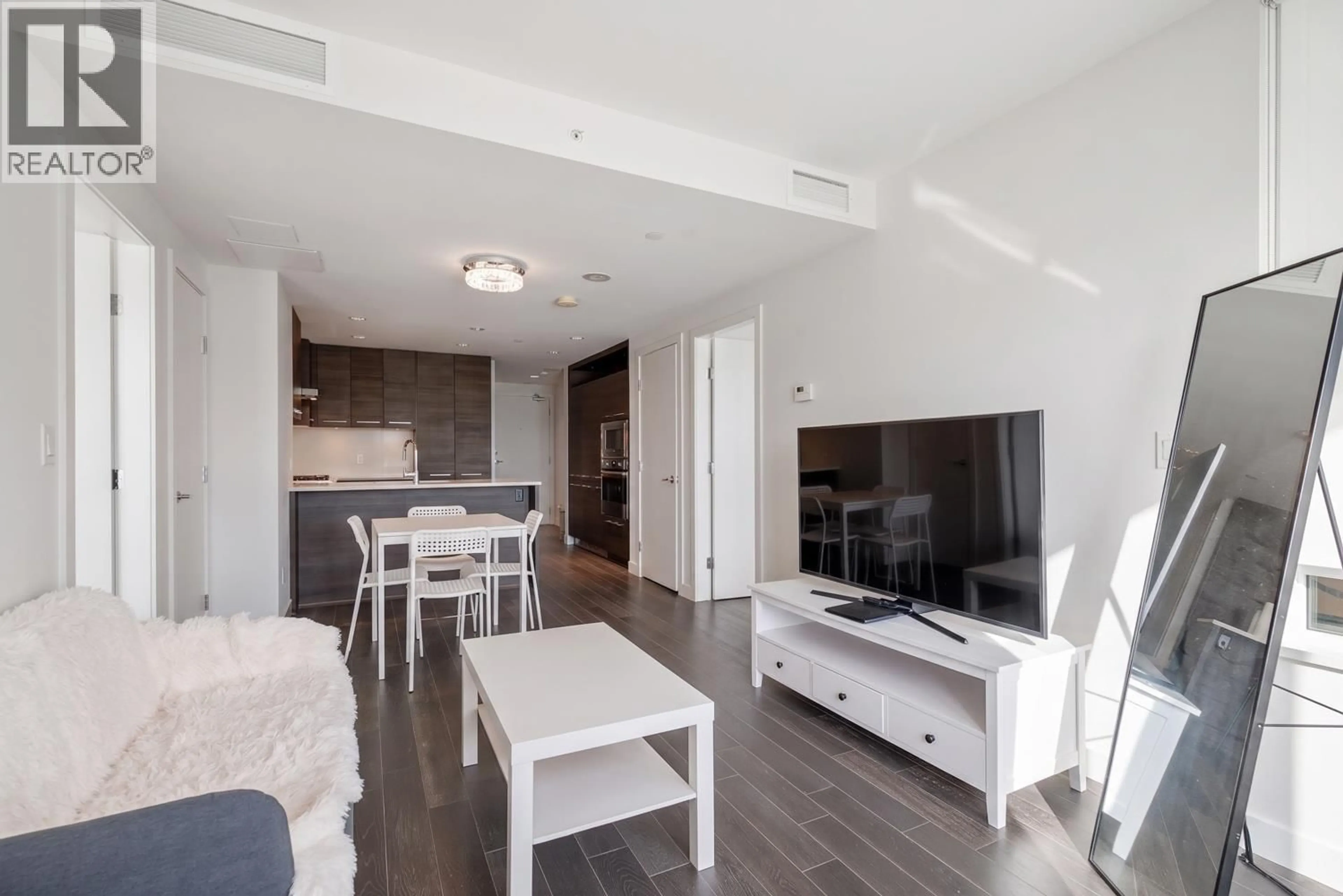 Living room with furniture, wood/laminate floor for 1007 - 7468 LANSDOWNE ROAD, Richmond British Columbia V7C0B7