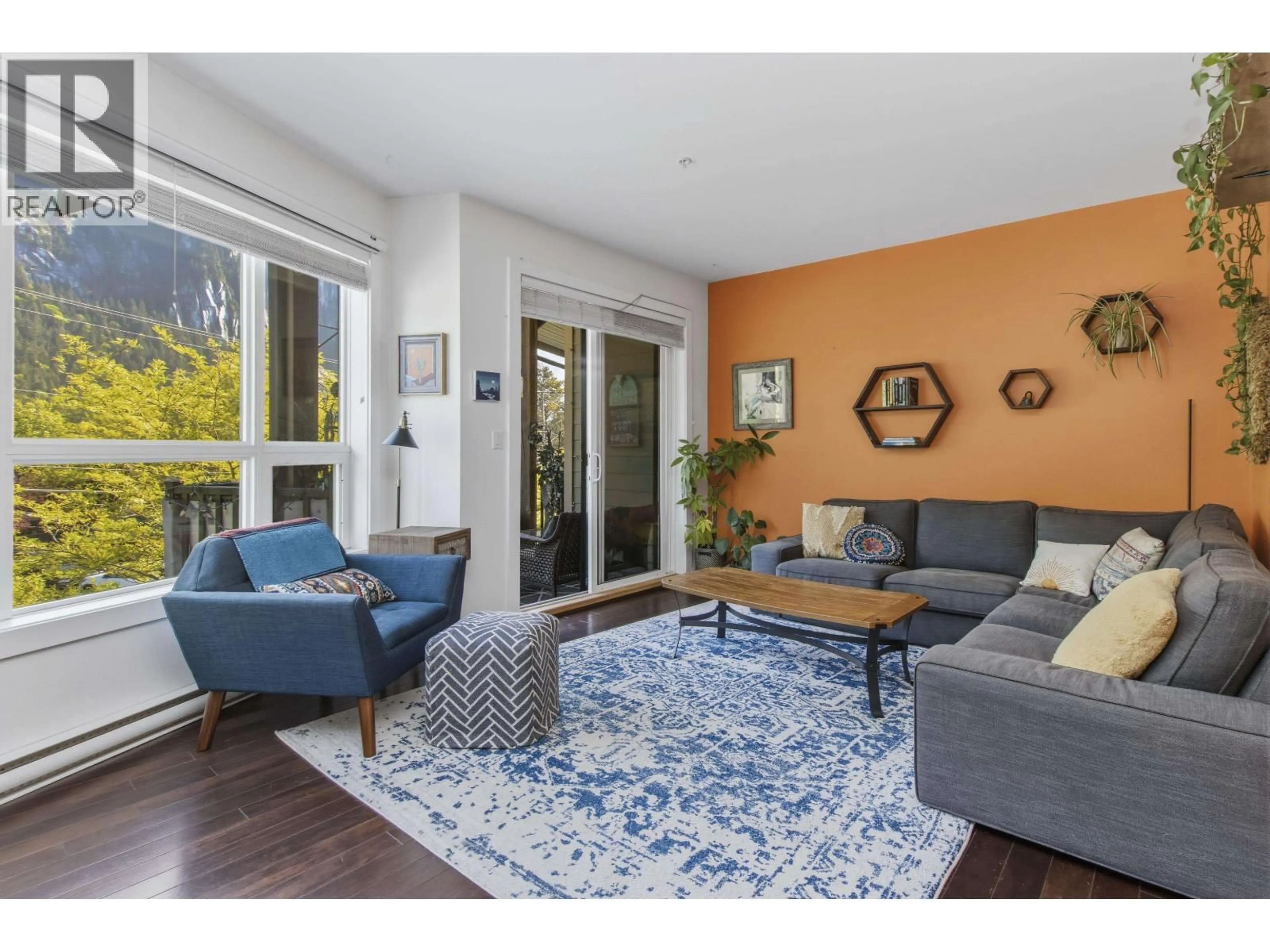 Living room with furniture, wood/laminate floor for 208 - 1909 MAPLE DRIVE, Squamish British Columbia V8B0T1