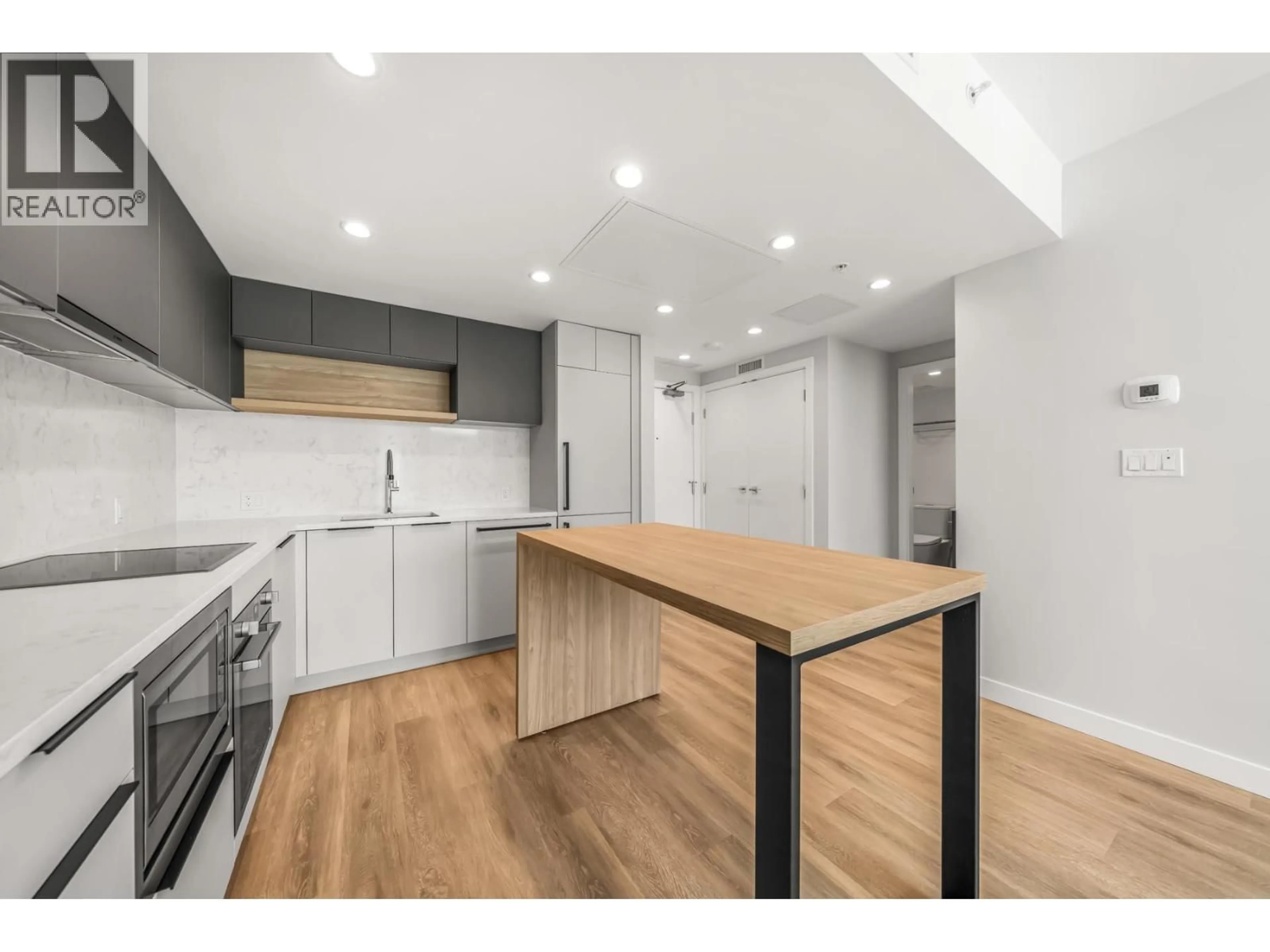 Open concept kitchen, wood/laminate floor for 1507 - 567 EMERSON STREET, Coquitlam British Columbia V6J0M8