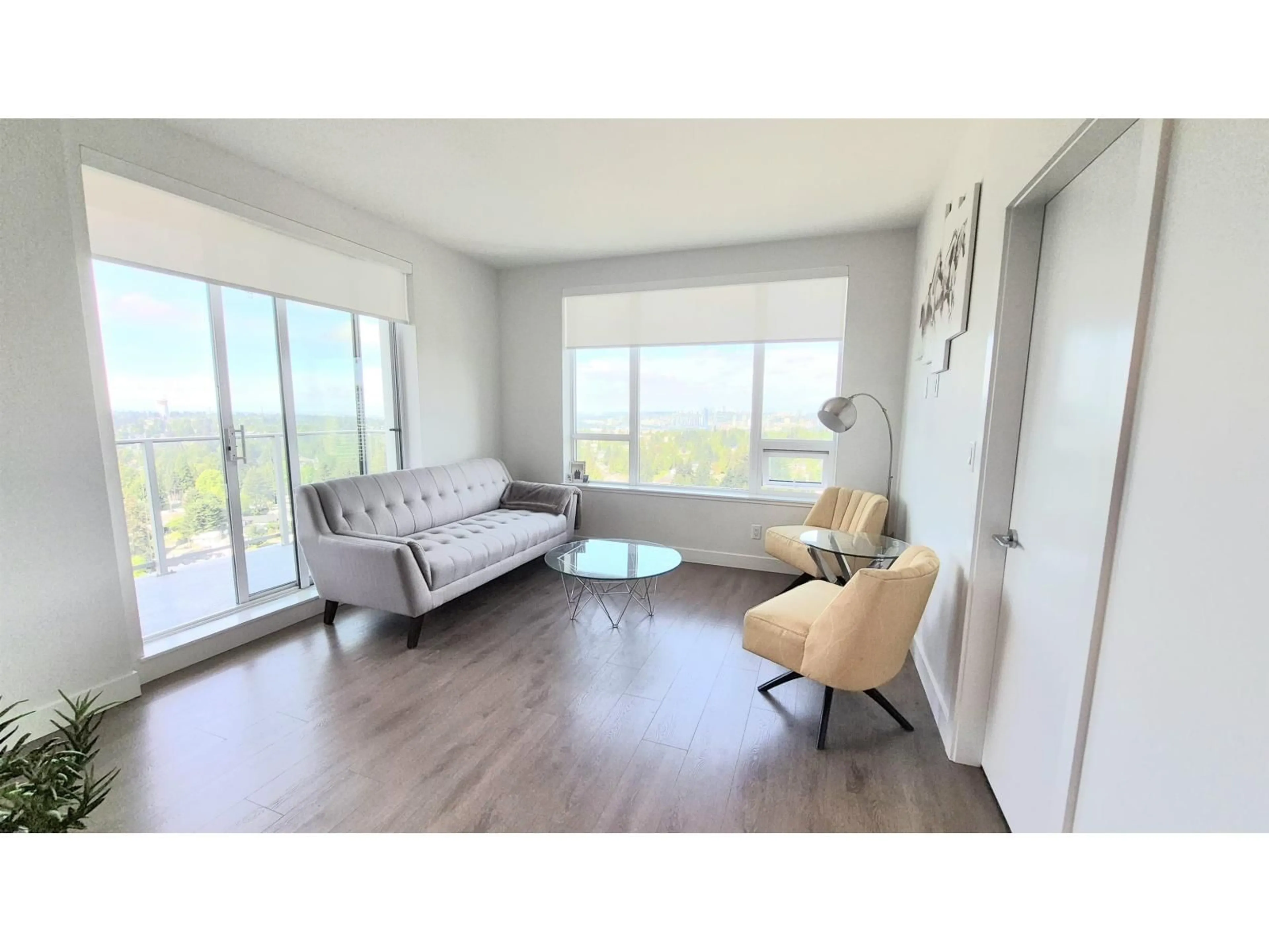 Living room with furniture, wood/laminate floor for 2207 - 13359 OLD YALE ROAD, Surrey British Columbia V3T0S4