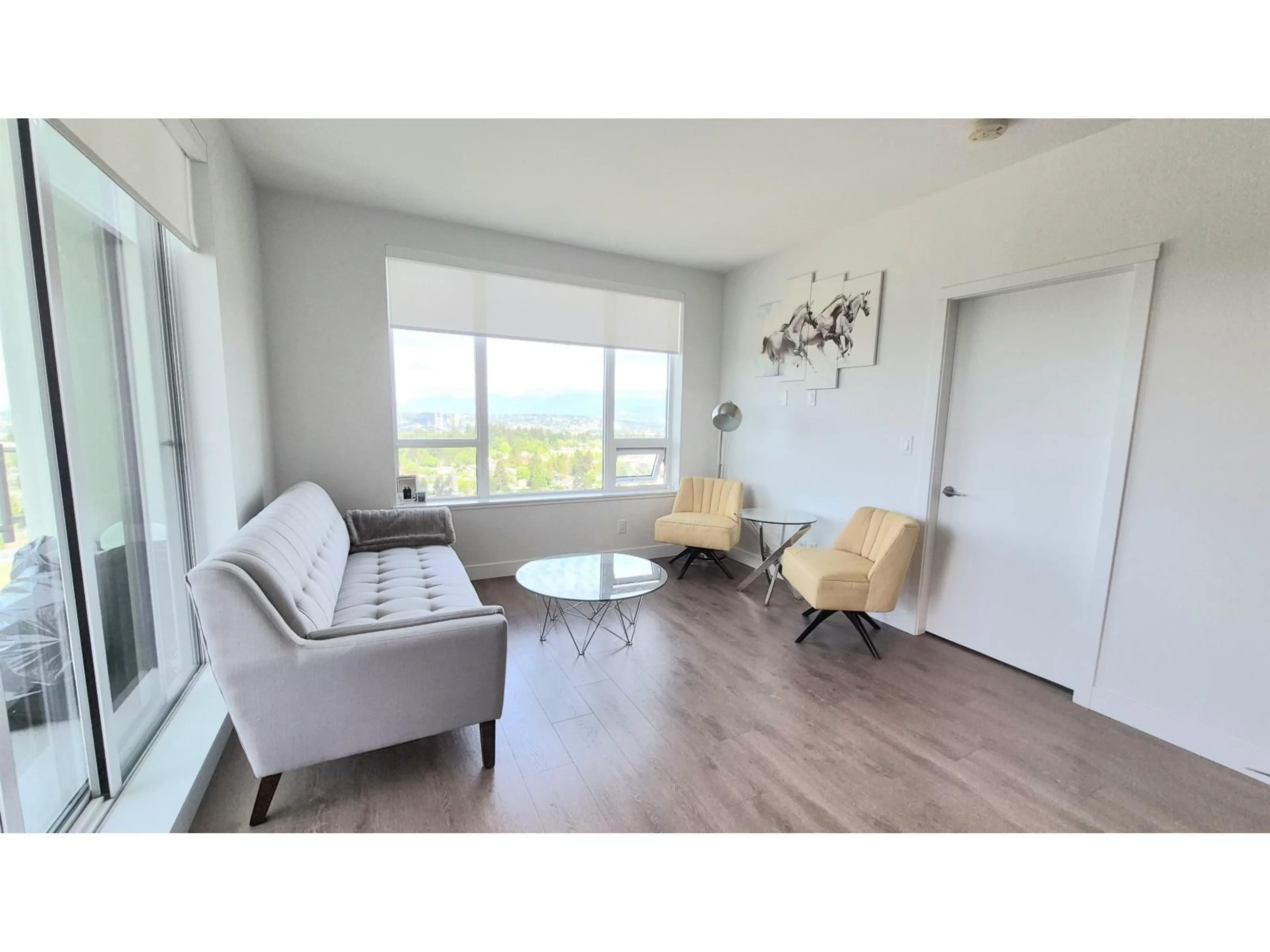 Living room with furniture, wood/laminate floor for 2207 - 13359 OLD YALE ROAD, Surrey British Columbia V3T0S4