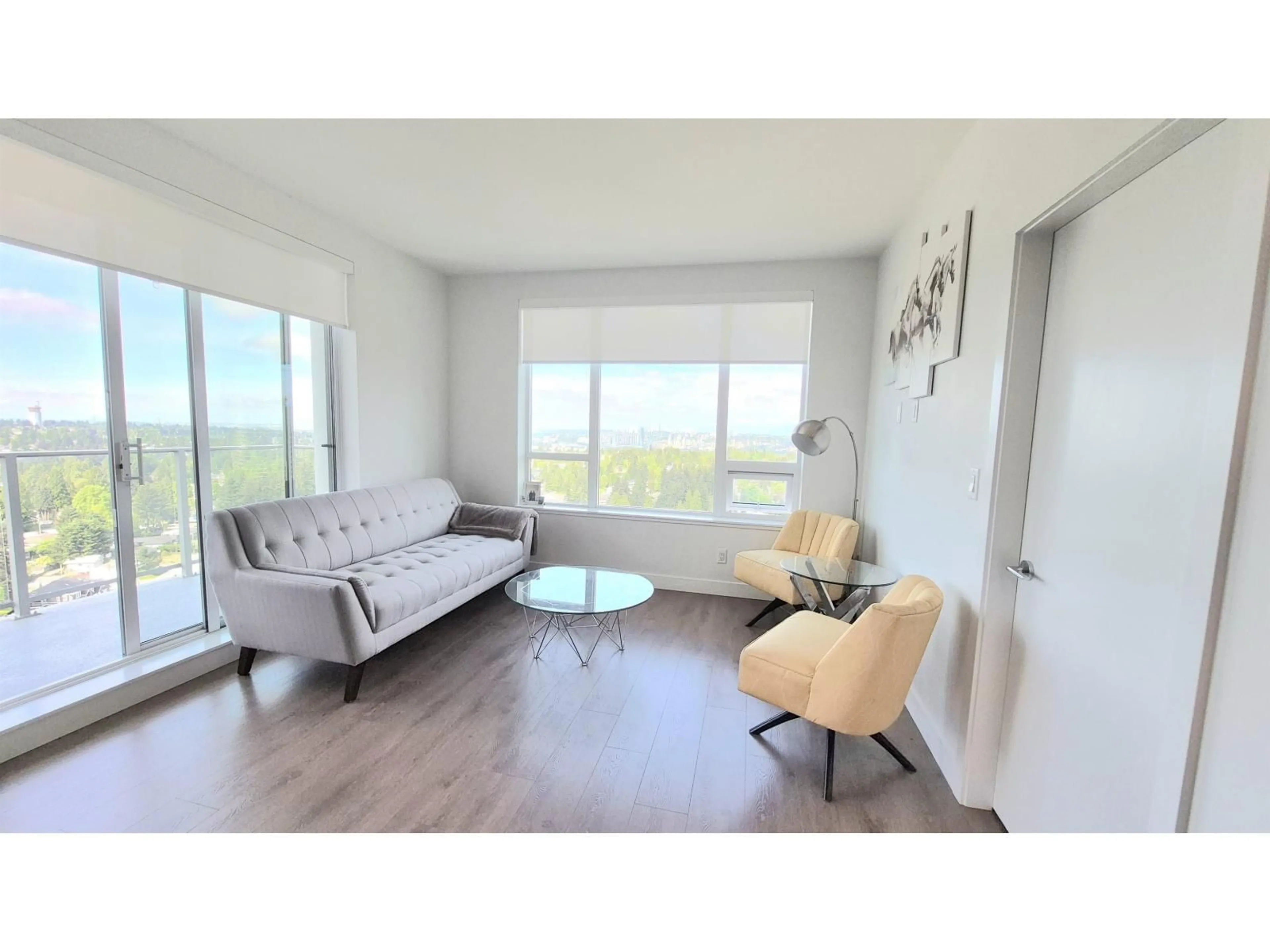 Living room with furniture, wood/laminate floor for 2207 - 13359 OLD YALE ROAD, Surrey British Columbia V3T0S4