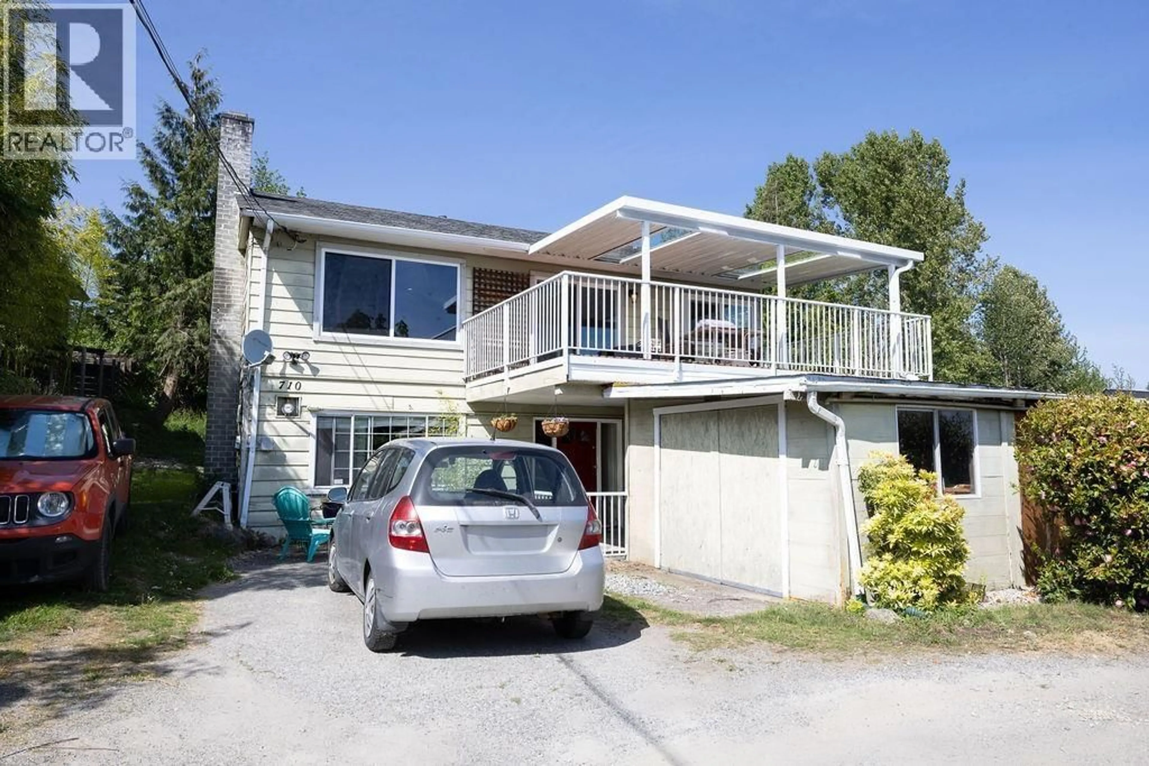 Home with vinyl exterior material, street for 710 GIBSONS WAY, Gibsons British Columbia V0N1V9