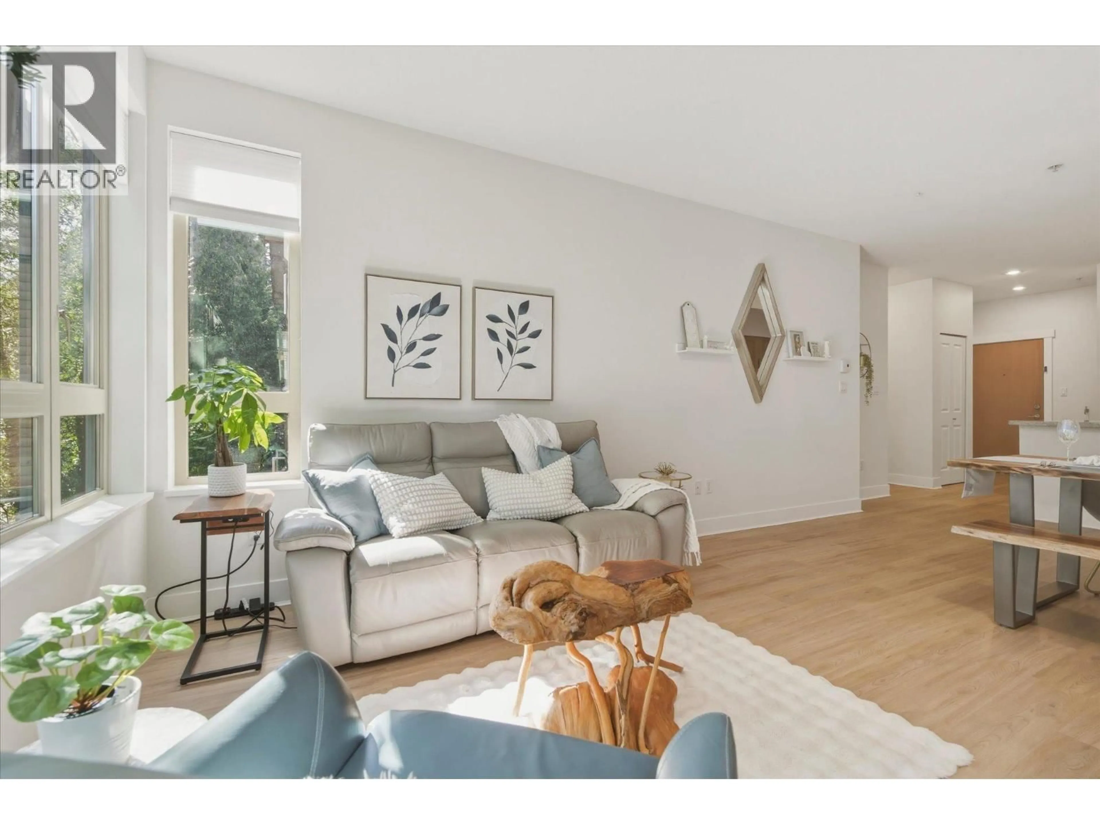 Living room with furniture, wood/laminate floor for 308 - 1111 27TH STREET, North Vancouver British Columbia V7J1S3