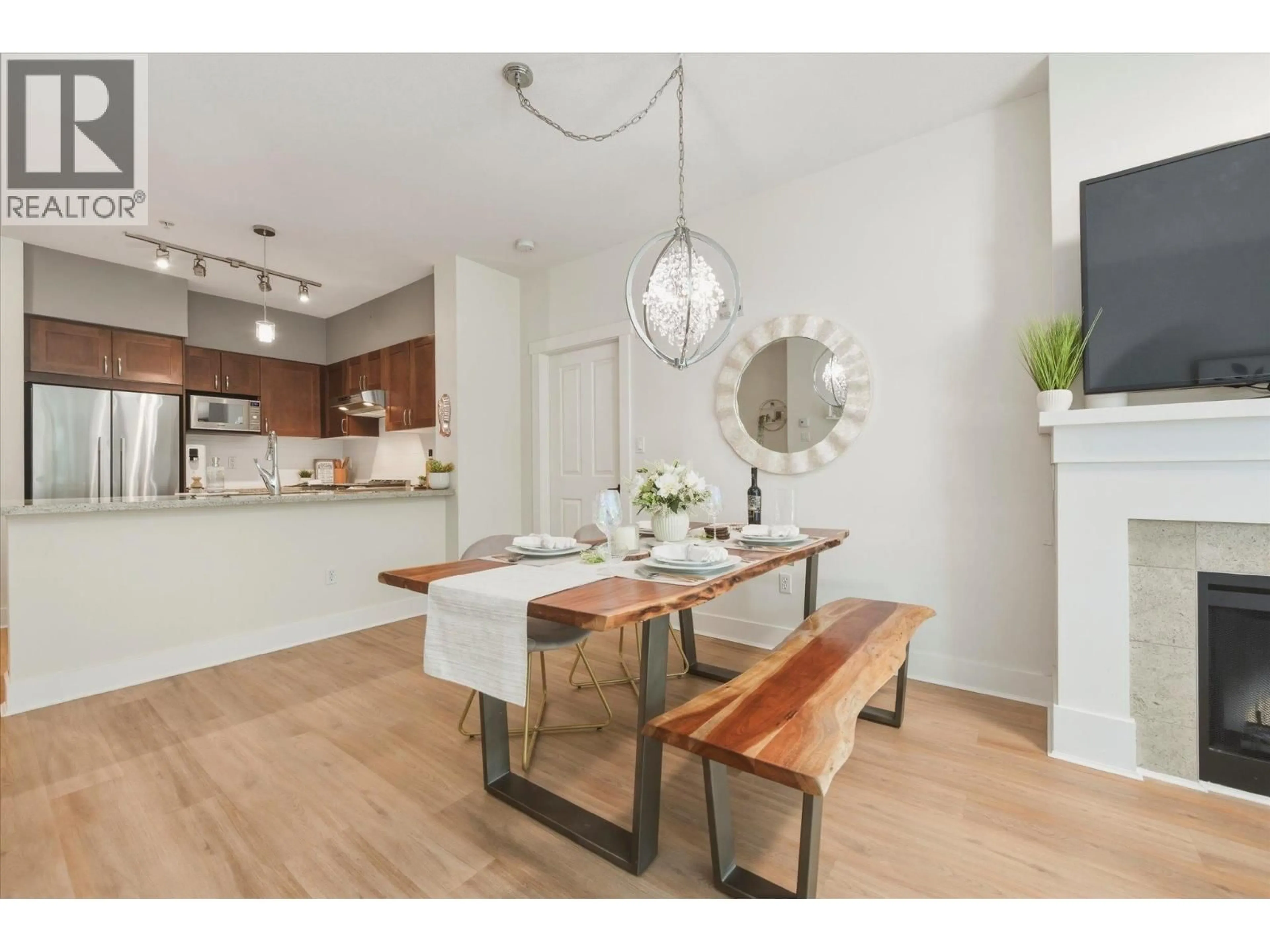 Open concept kitchen, wood/laminate floor for 308 - 1111 27TH STREET, North Vancouver British Columbia V7J1S3