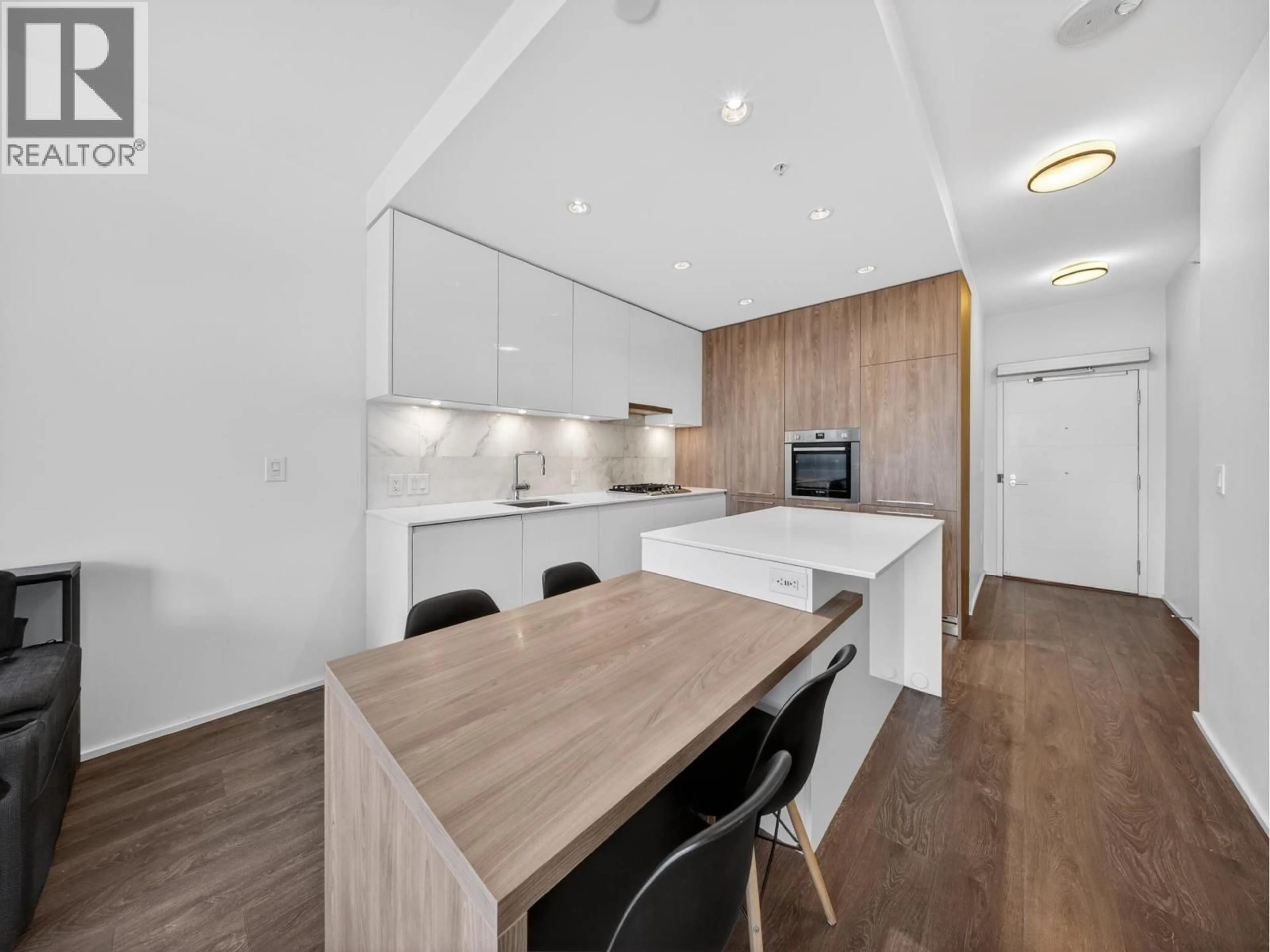 Open concept kitchen, wood/laminate floor for 808 - 1955 ALPHA WAY, Burnaby British Columbia V5C0K6