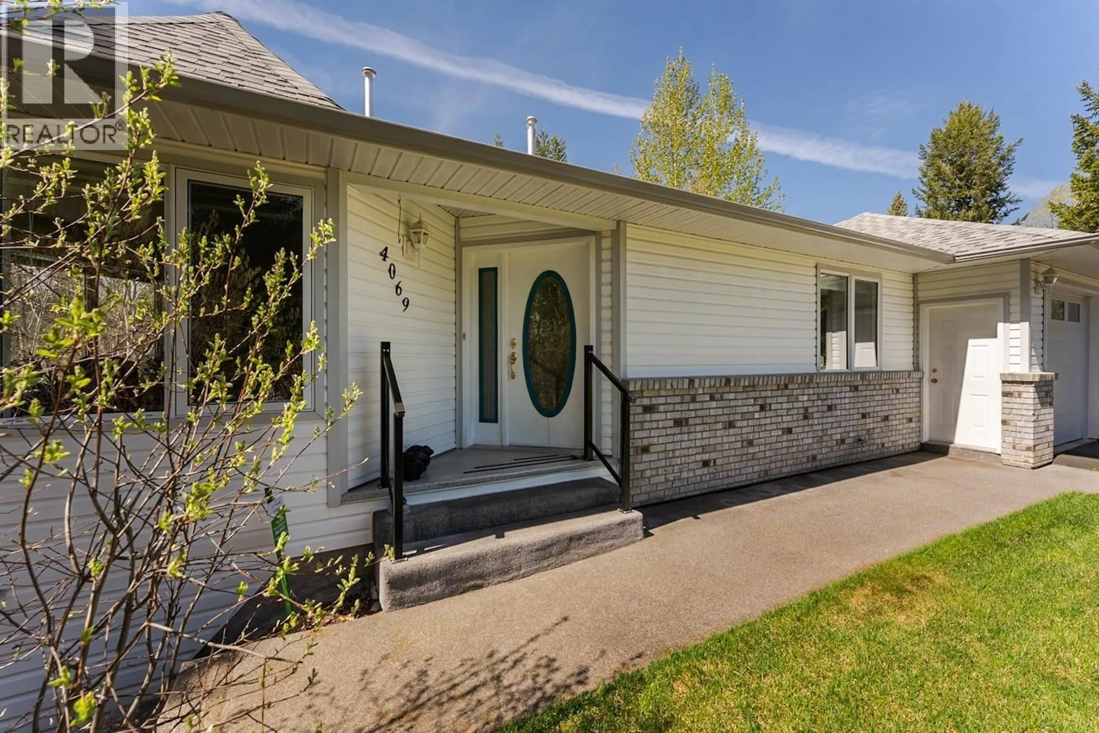 Home with vinyl exterior material, street for 4069 EVA PLACE, Prince George British Columbia V2K4Z4