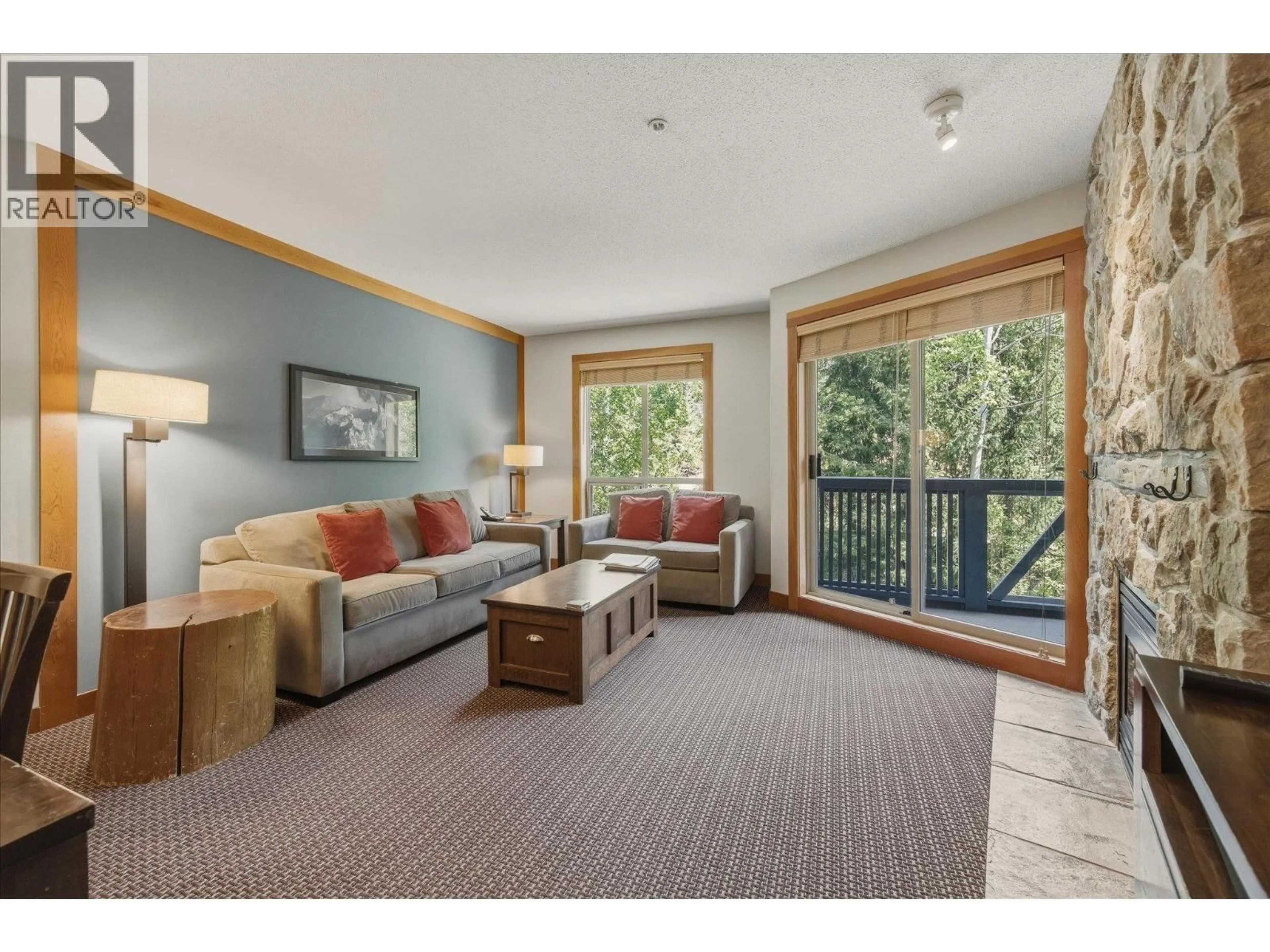 Living room with furniture, wood/laminate floor for 432C - 2036 LONDON LANE, Whistler British Columbia V8E0N7