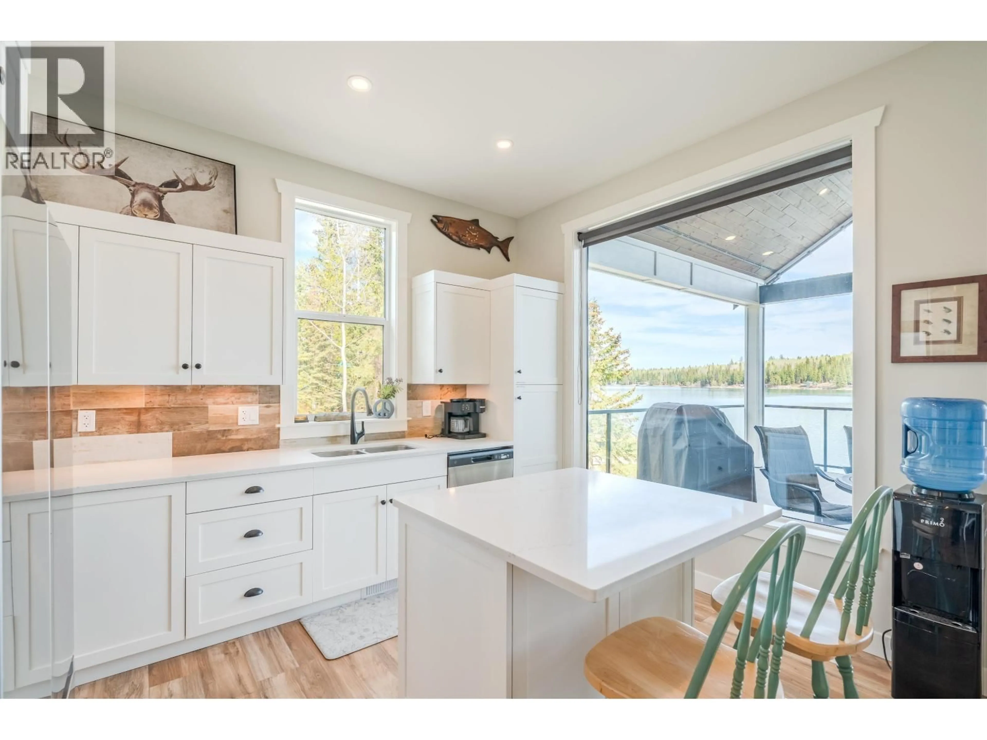 Open concept kitchen, wood/laminate floor for 7231 NATH ROAD, Sheridan Lake British Columbia V0K1X1