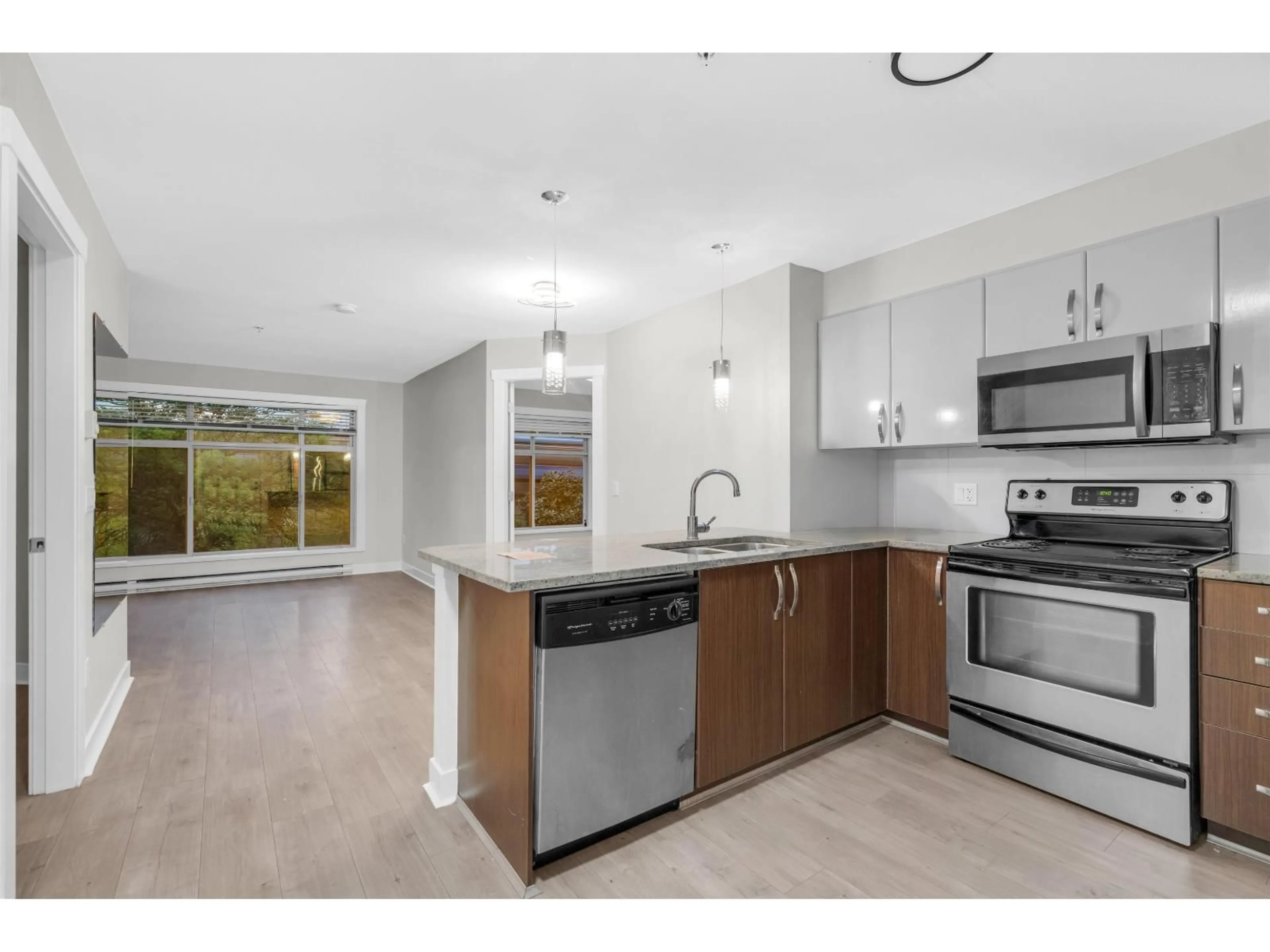 Open concept kitchen, unknown for 211 - 13555 GATEWAY DRIVE, Surrey British Columbia V3T0B5