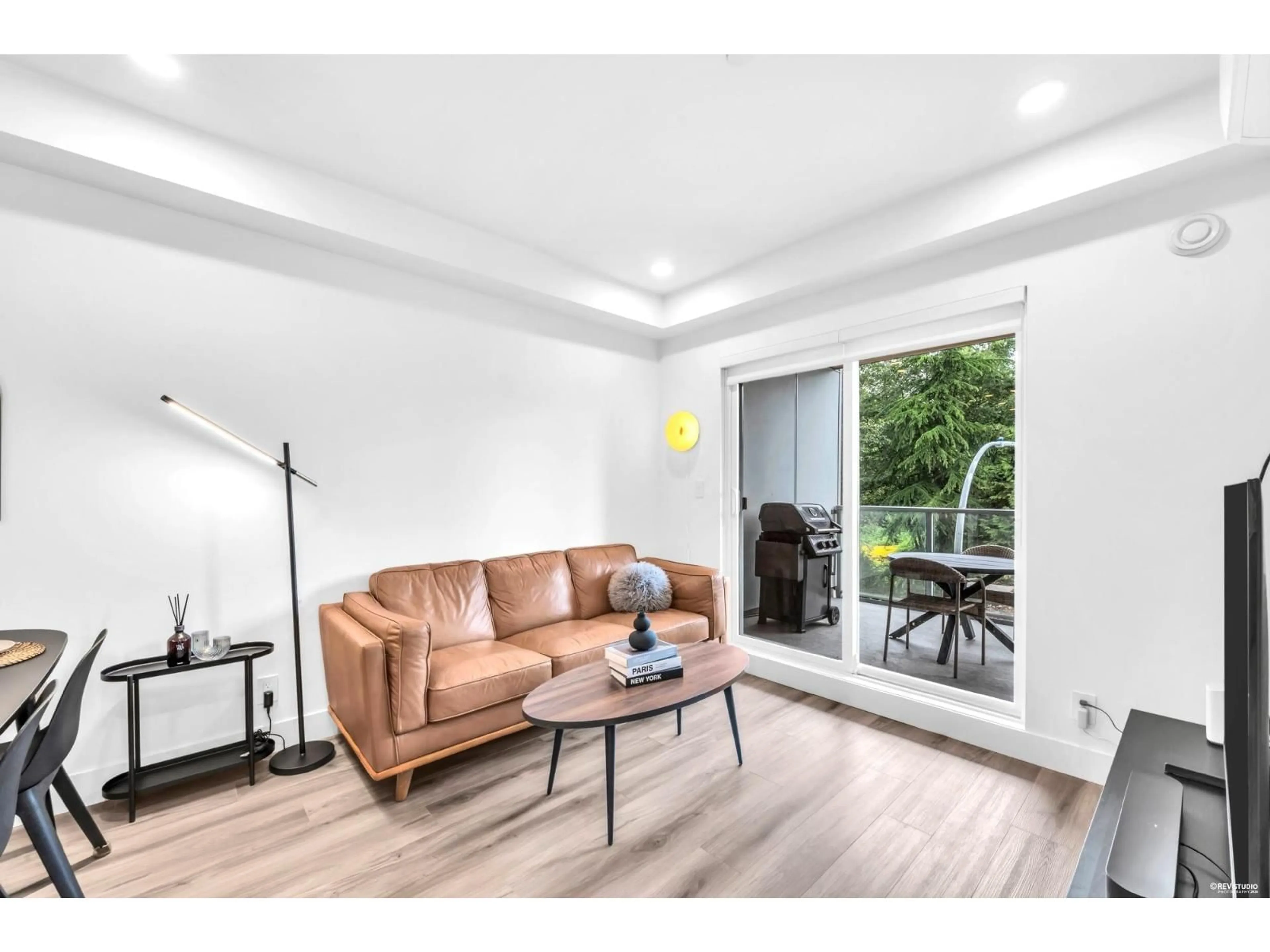 Living room with furniture, wood/laminate floor for A310 - 8447 202 STREET, Langley British Columbia V2Y4K2