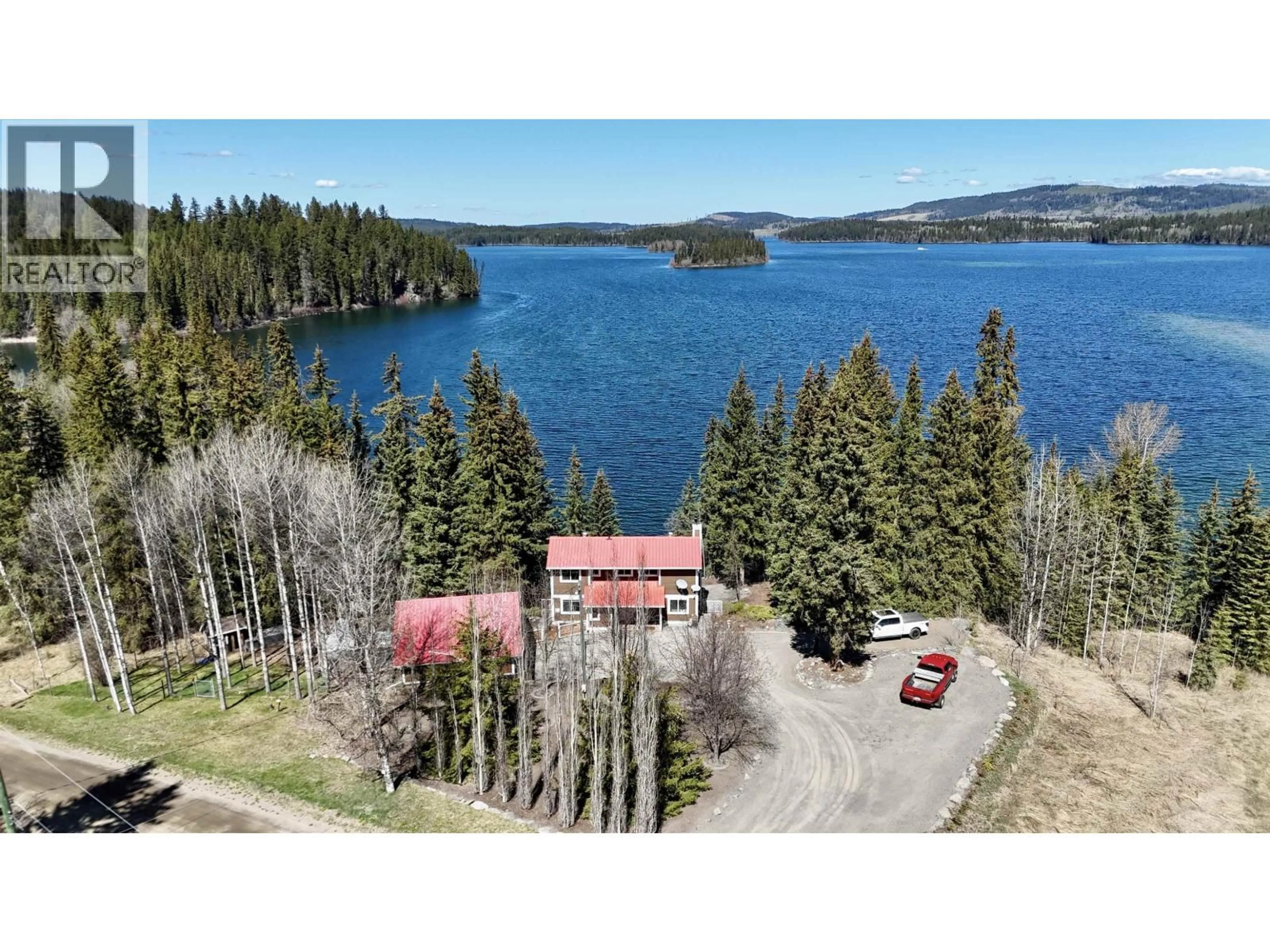 A pic from outside/outdoor area/front of a property/back of a property/a pic from drone, water/lake/river/ocean view for 8187 COTTONWOOD BAY ROAD, Bridge Lake British Columbia V0K1X2