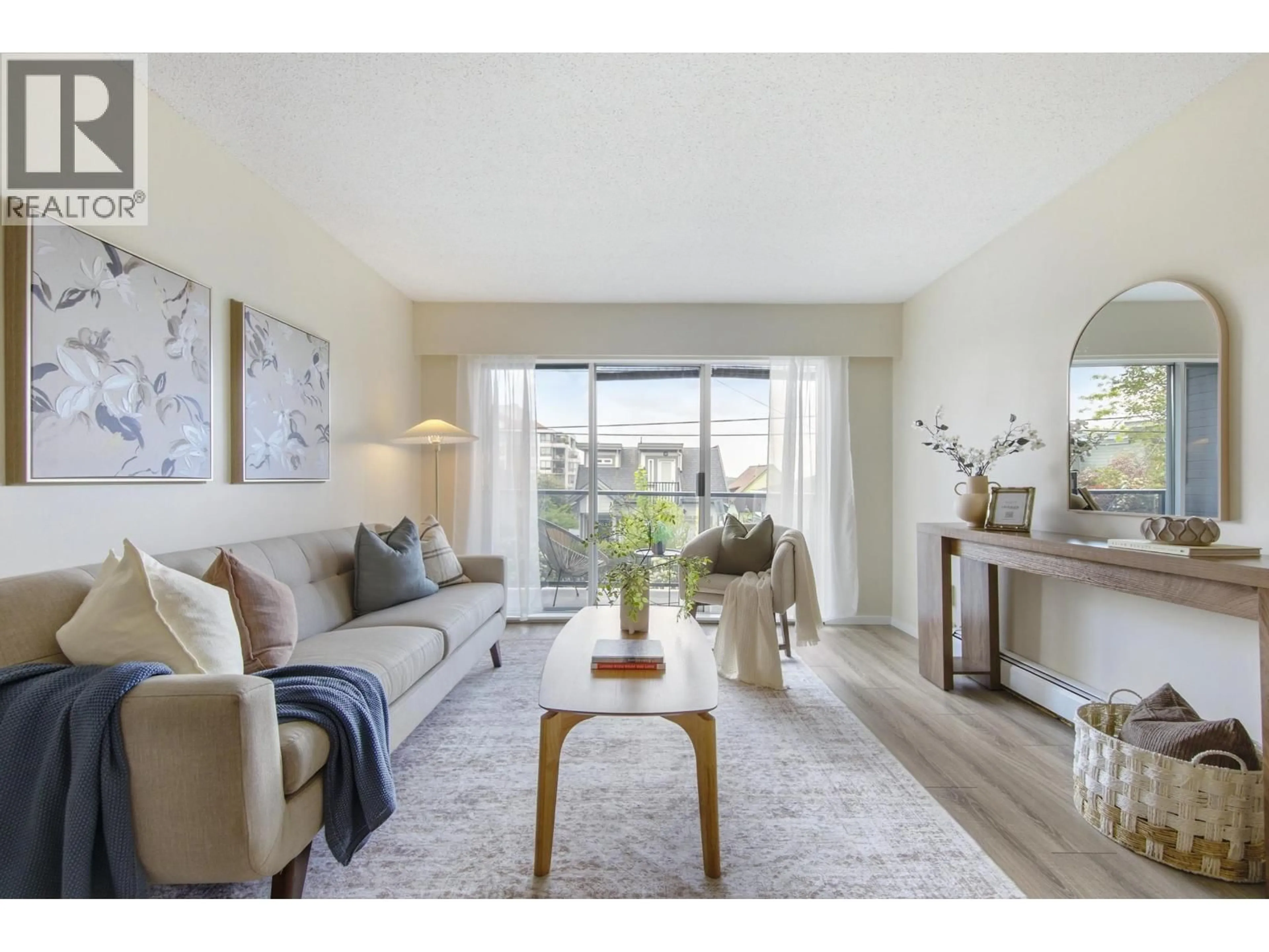 Living room with furniture, wood/laminate floor for 108 - 230 MOWAT STREET, New Westminster British Columbia V3M4B2