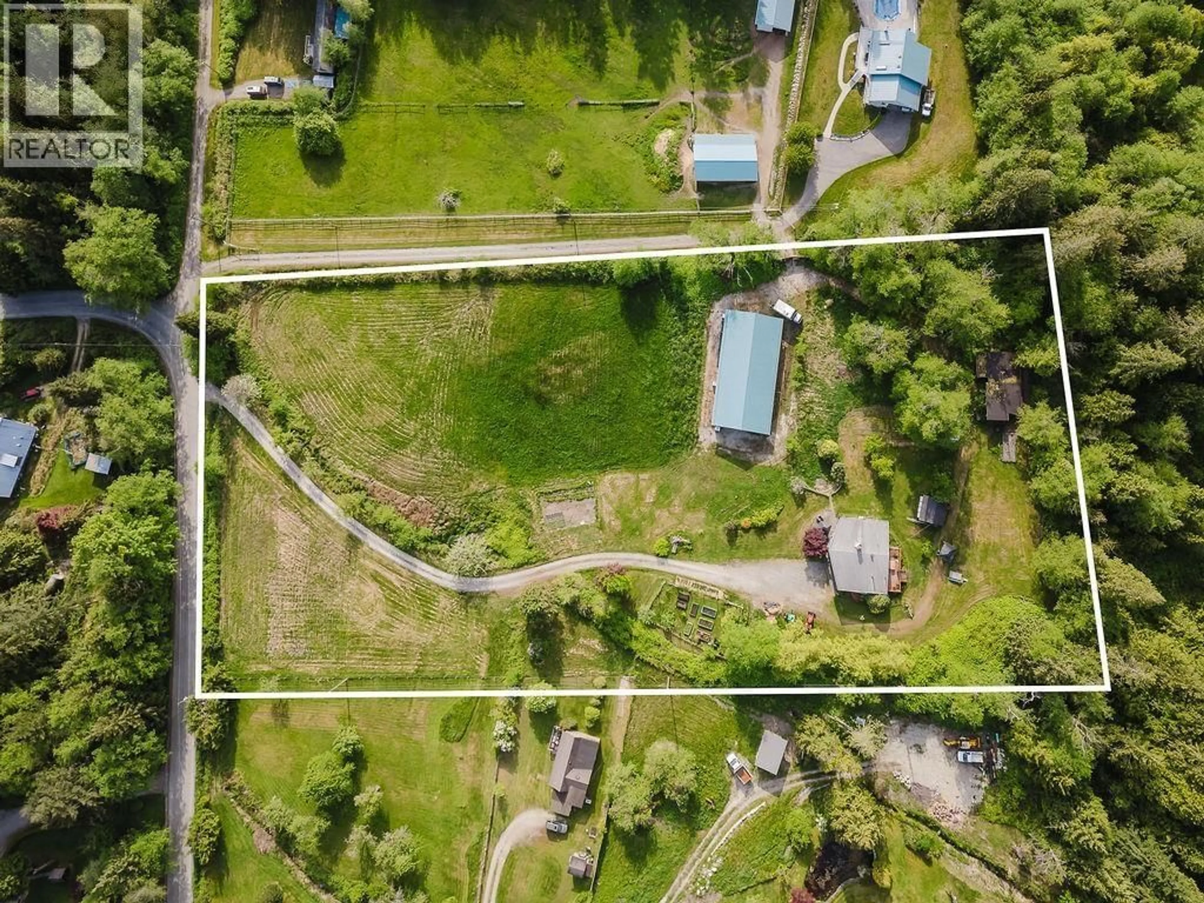 A pic from outside/outdoor area/front of a property/back of a property/a pic from drone, street for 1972 RANCH ROAD, Roberts Creek British Columbia V0N2W5
