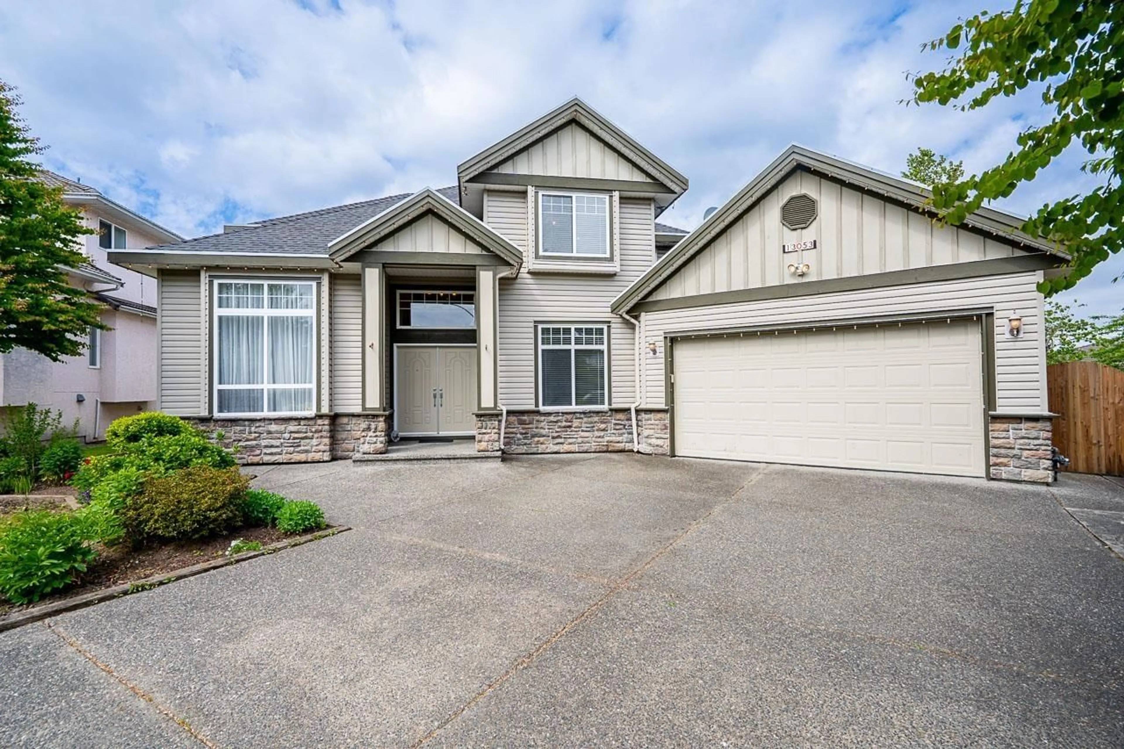 Home with vinyl exterior material, street for 13053 96A AVENUE, Surrey British Columbia V3T5N3