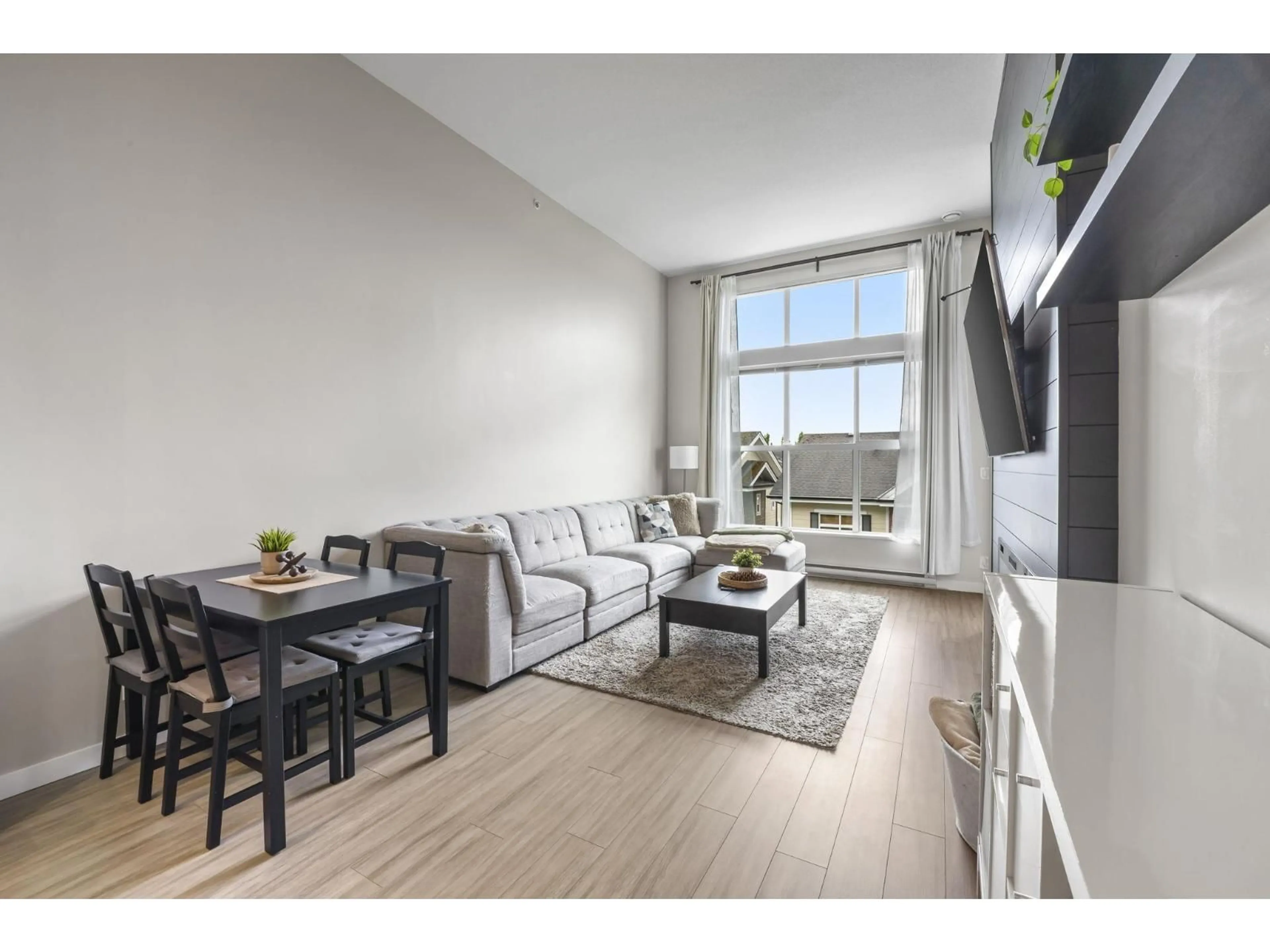 Living room with furniture, wood/laminate floor for D413 - 8150 207 STREET, Langley British Columbia V2Y4J5