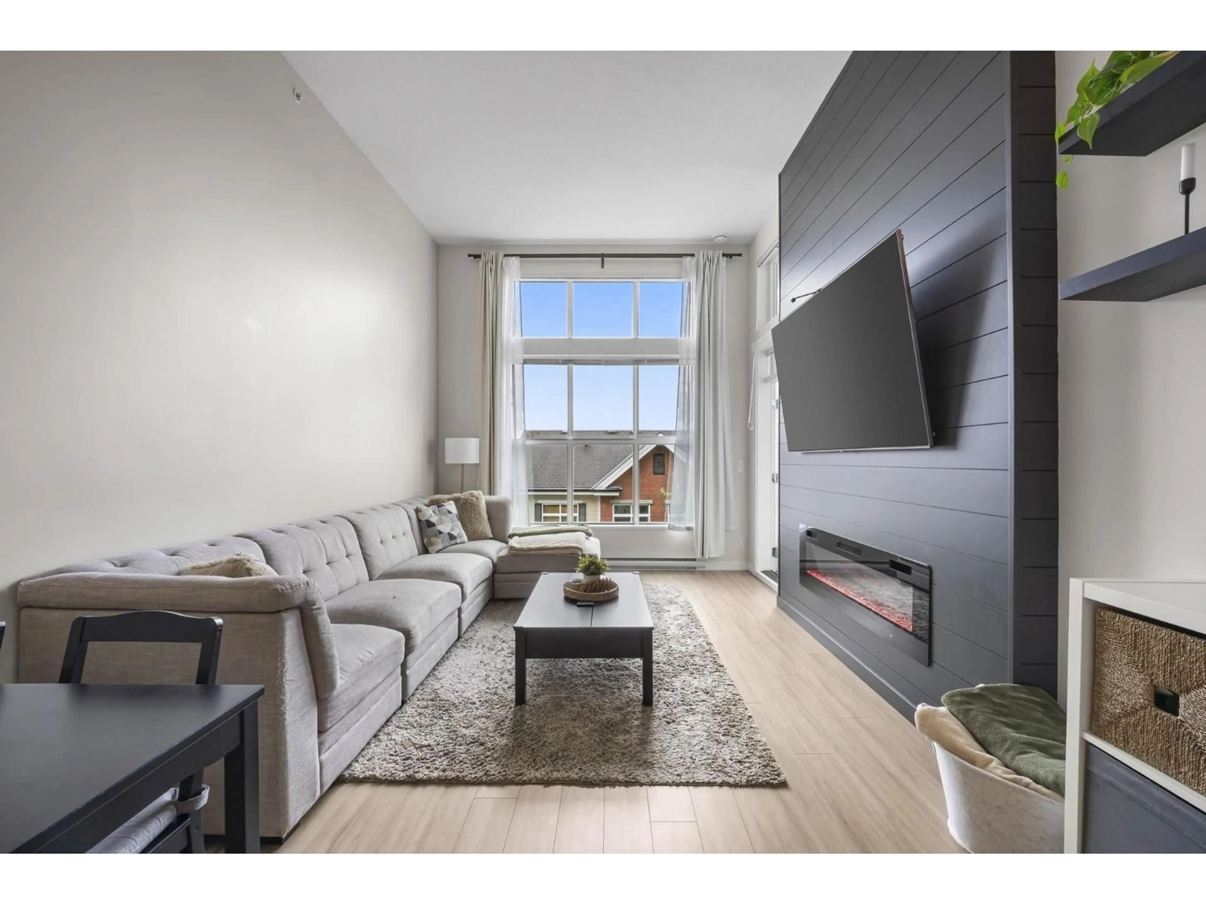 Living room with furniture, wood/laminate floor for D413 - 8150 207 STREET, Langley British Columbia V2Y4J5