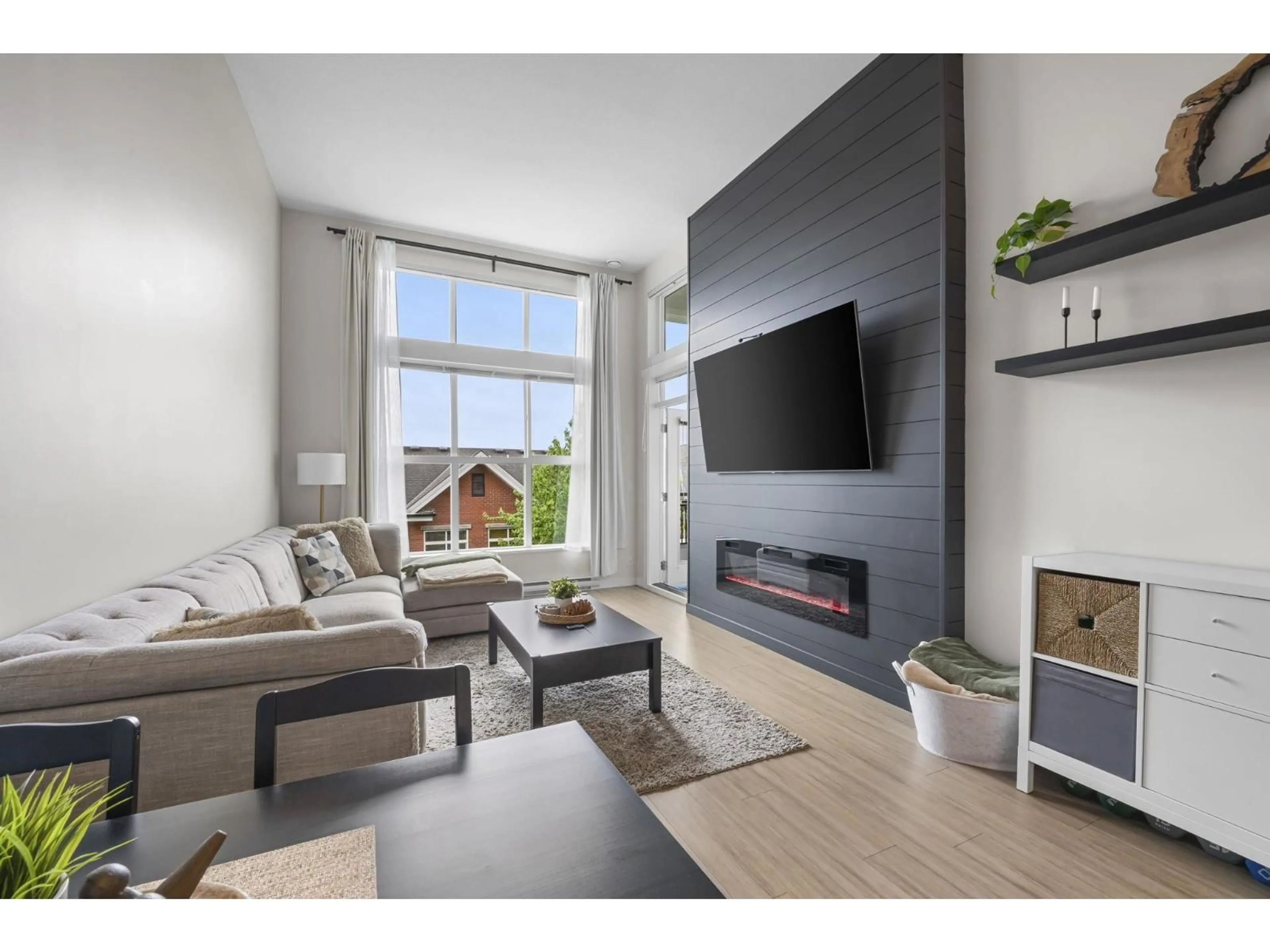 Living room with furniture, wood/laminate floor for D413 - 8150 207 STREET, Langley British Columbia V2Y4J5