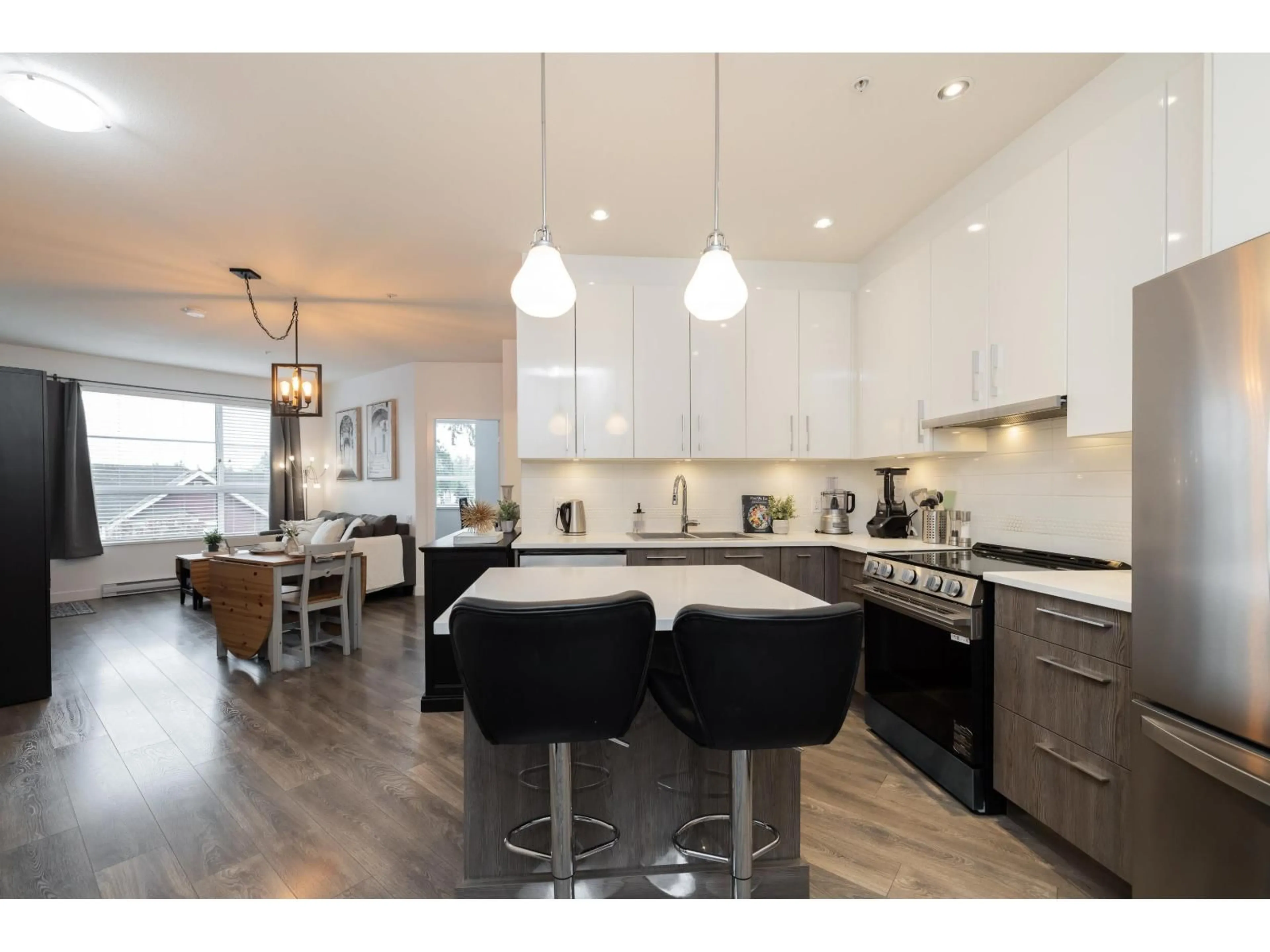 Open concept kitchen, wood/laminate floor for 418 - 20829 77A AVENUE, Langley British Columbia V2Y0Y5
