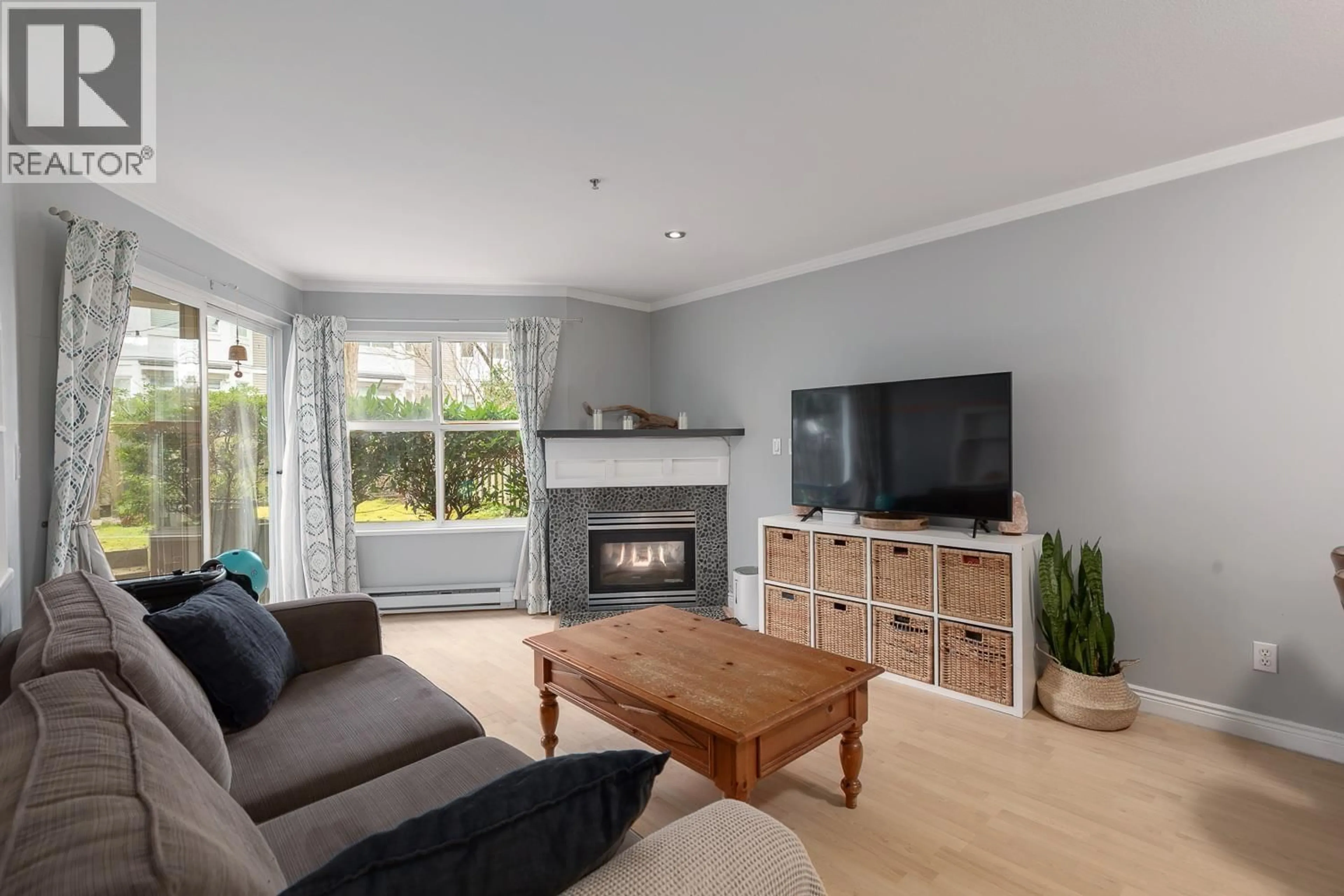 Living room with furniture, wood/laminate floor for 107 - 3038 KENT AVENUE SOUTH, Vancouver British Columbia V5S4V8