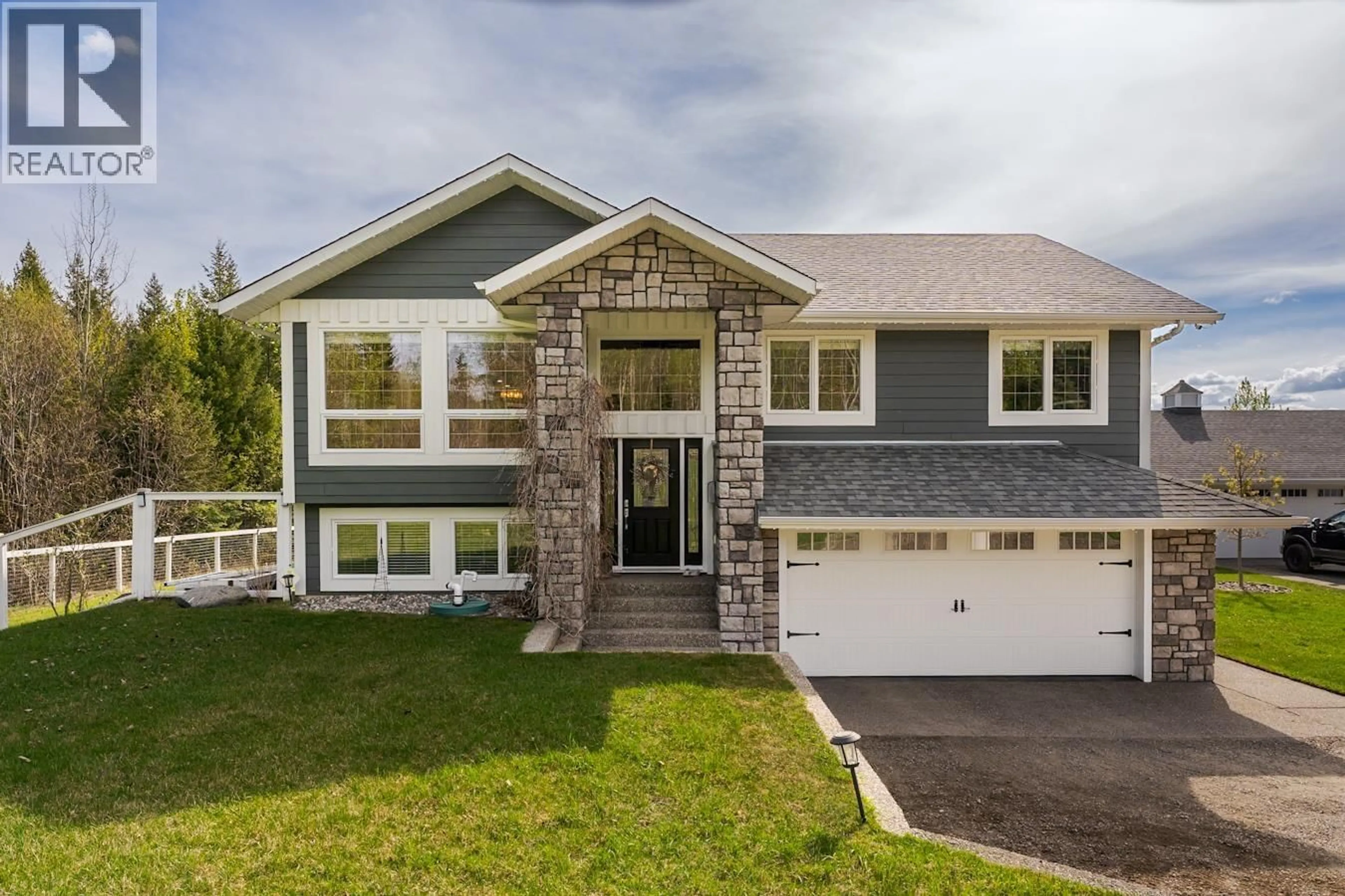 Home with vinyl exterior material, street for 5250 CRANBROOK HILL ROAD, Prince George British Columbia V2M7C4
