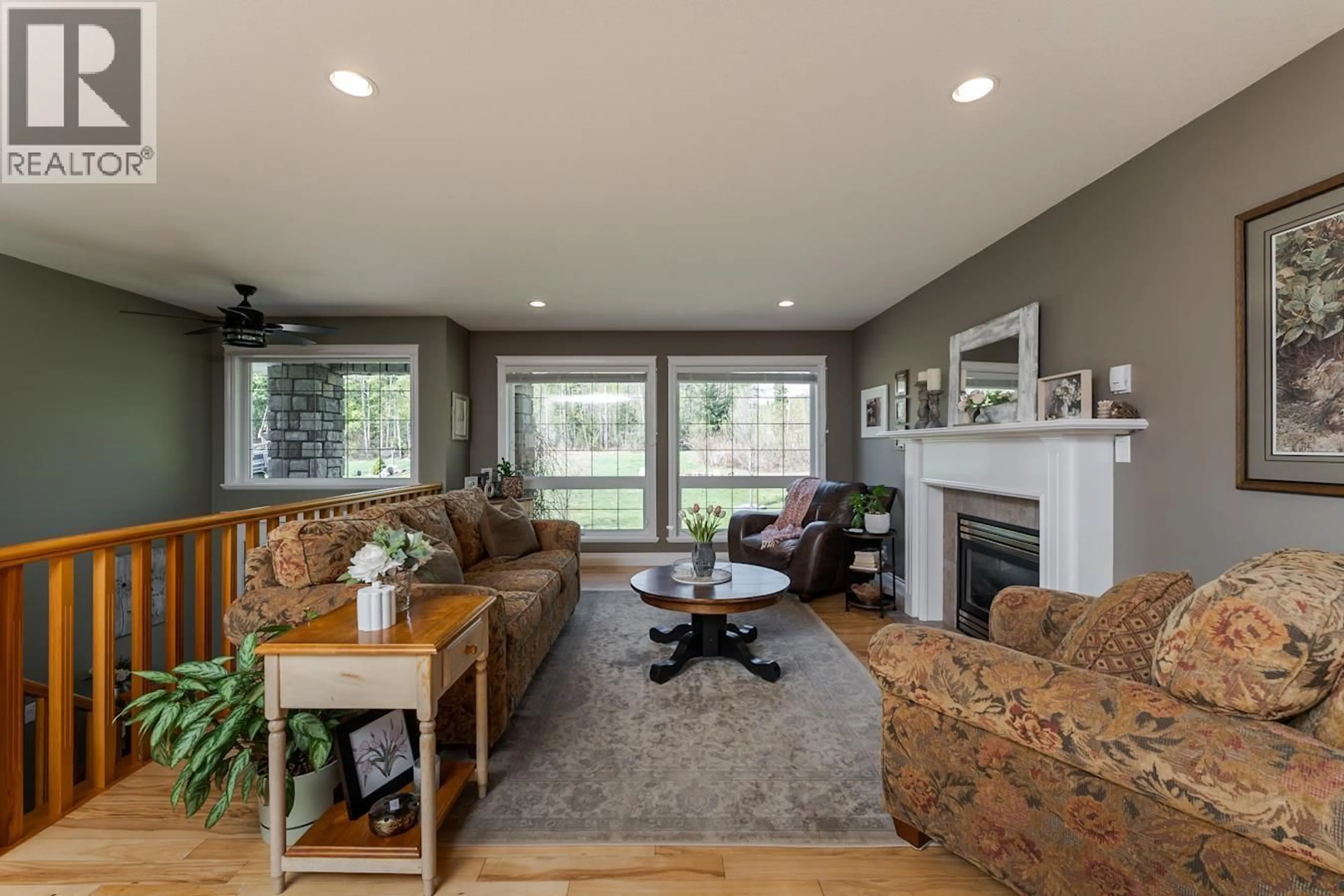 Living room with furniture, wood/laminate floor for 5250 CRANBROOK HILL ROAD, Prince George British Columbia V2M7C4