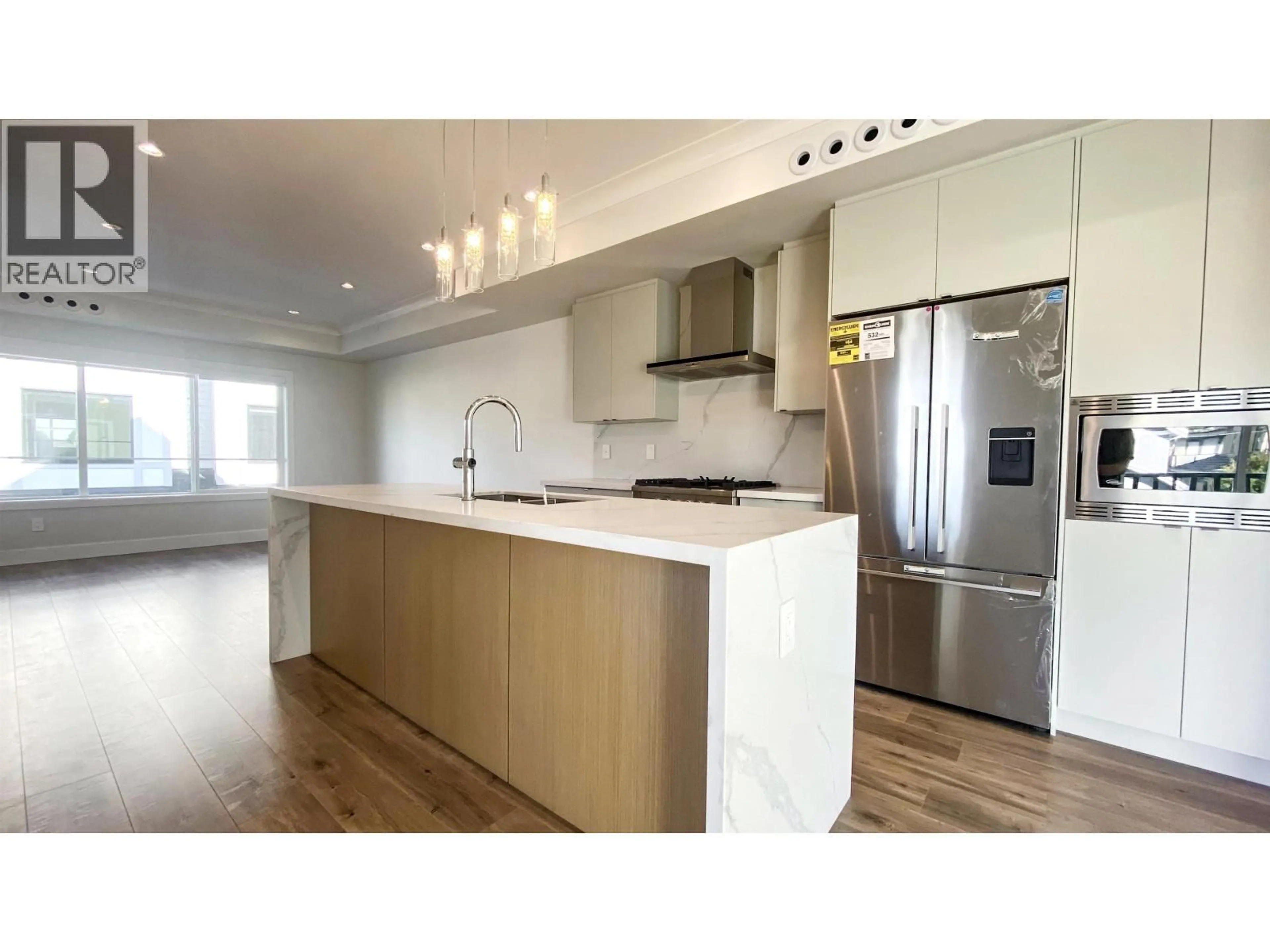 Open concept kitchen, wood/laminate floor for 1 - 9680 WILLIAMS ROAD, Richmond British Columbia V7A0B3