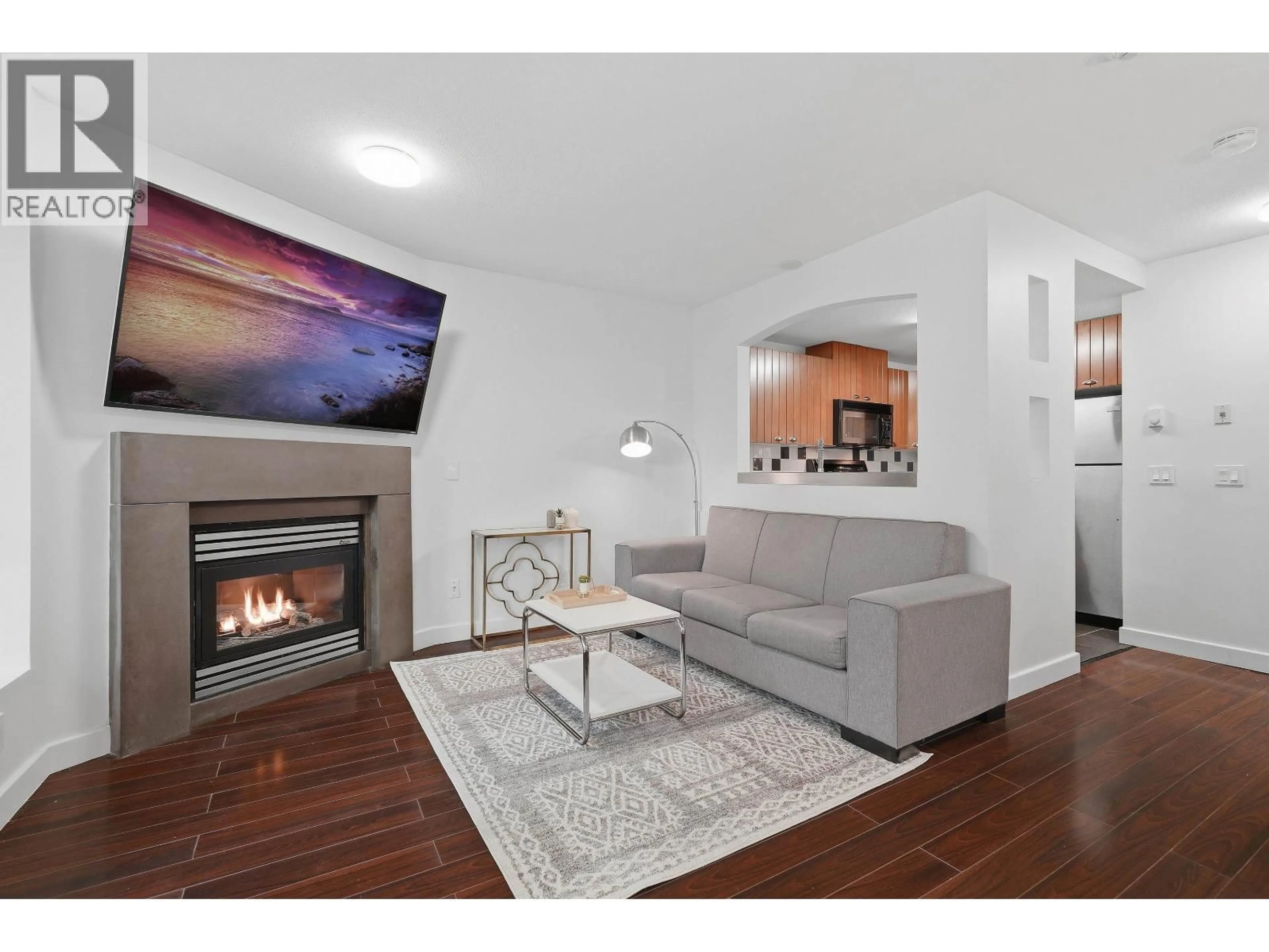 Living room with furniture, wood/laminate floor for 7327 MAGNOLIA TERRACE, Burnaby British Columbia V5E4M3