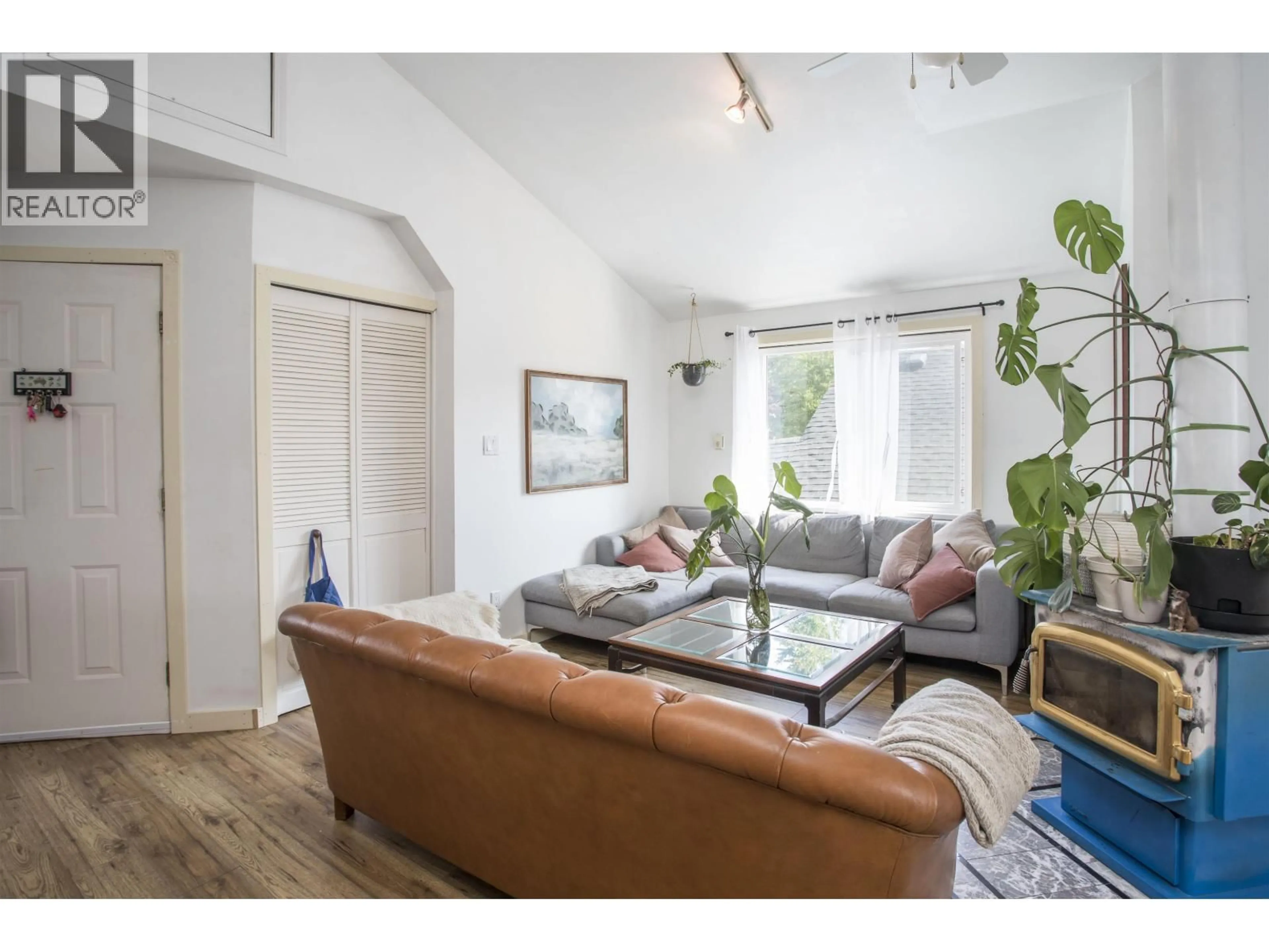 Living room with furniture, wood/laminate floor for 2051 STEPHENS STREET, Vancouver British Columbia V6K3W2