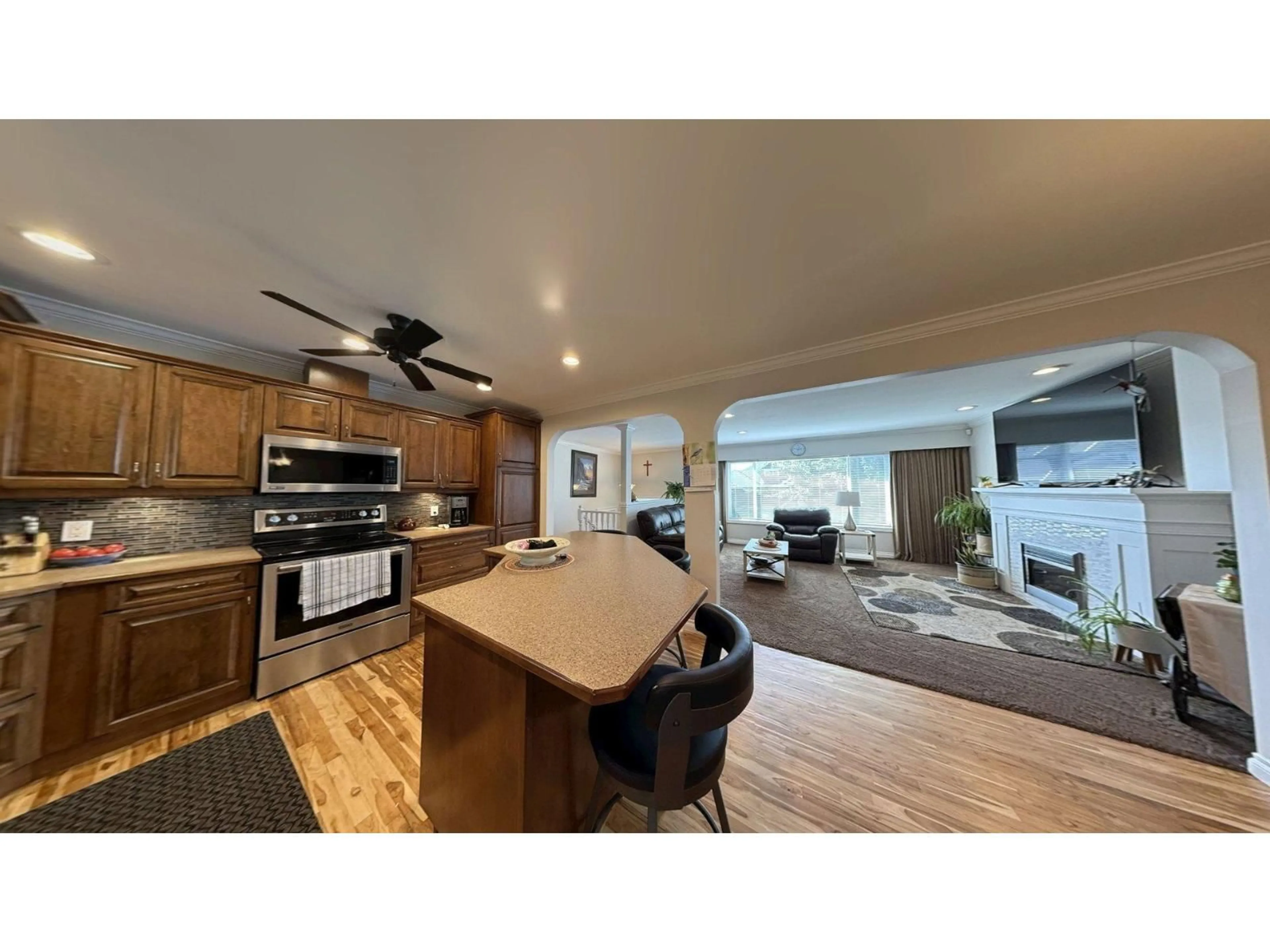 Open concept kitchen, wood/laminate floor for 6780 SCHOOL LANE, Chilliwack British Columbia V2R2C9