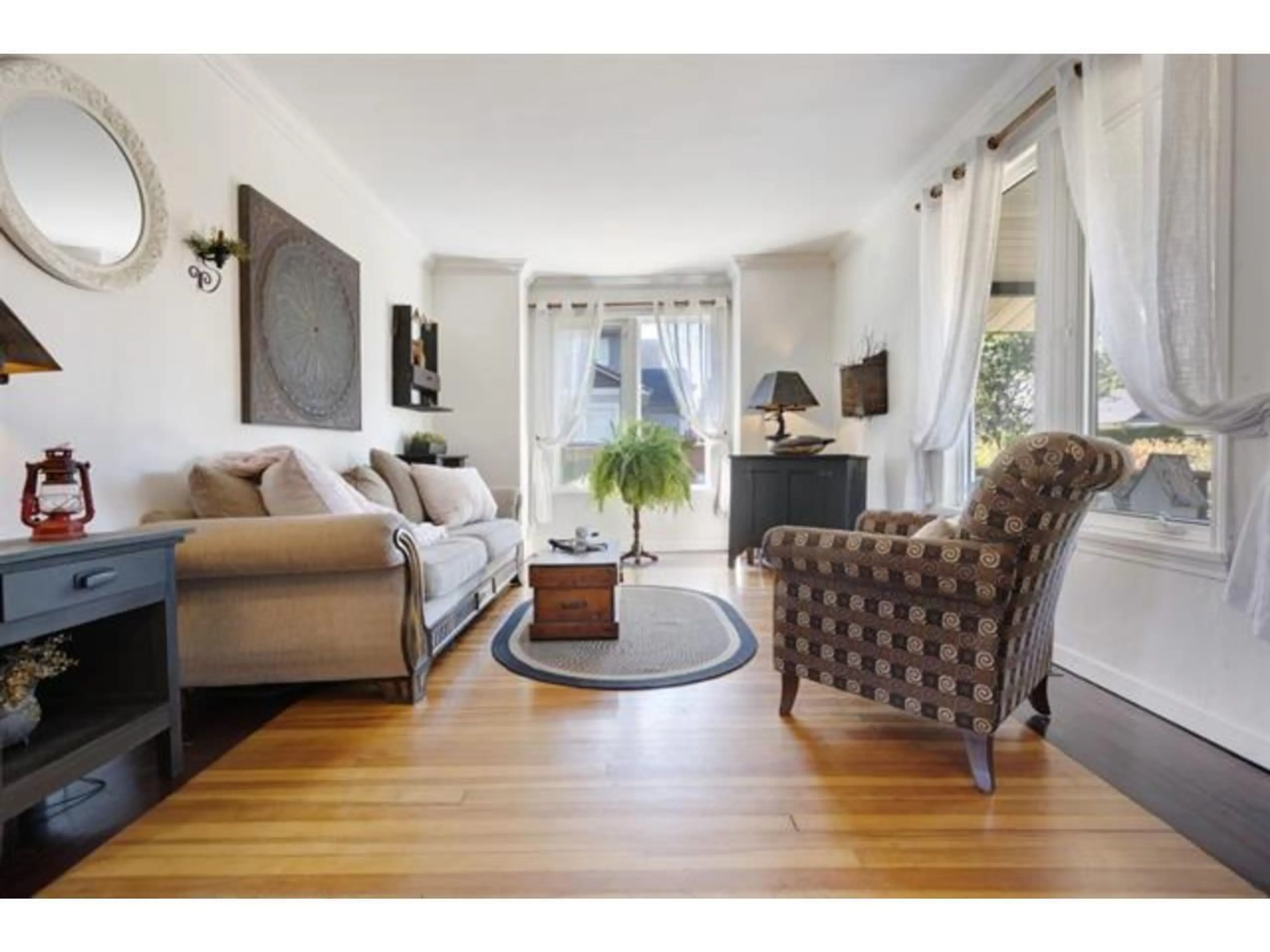 Living room with furniture, wood/laminate floor for 5690 RIVERSIDE STREET, Abbotsford British Columbia V4X1T4