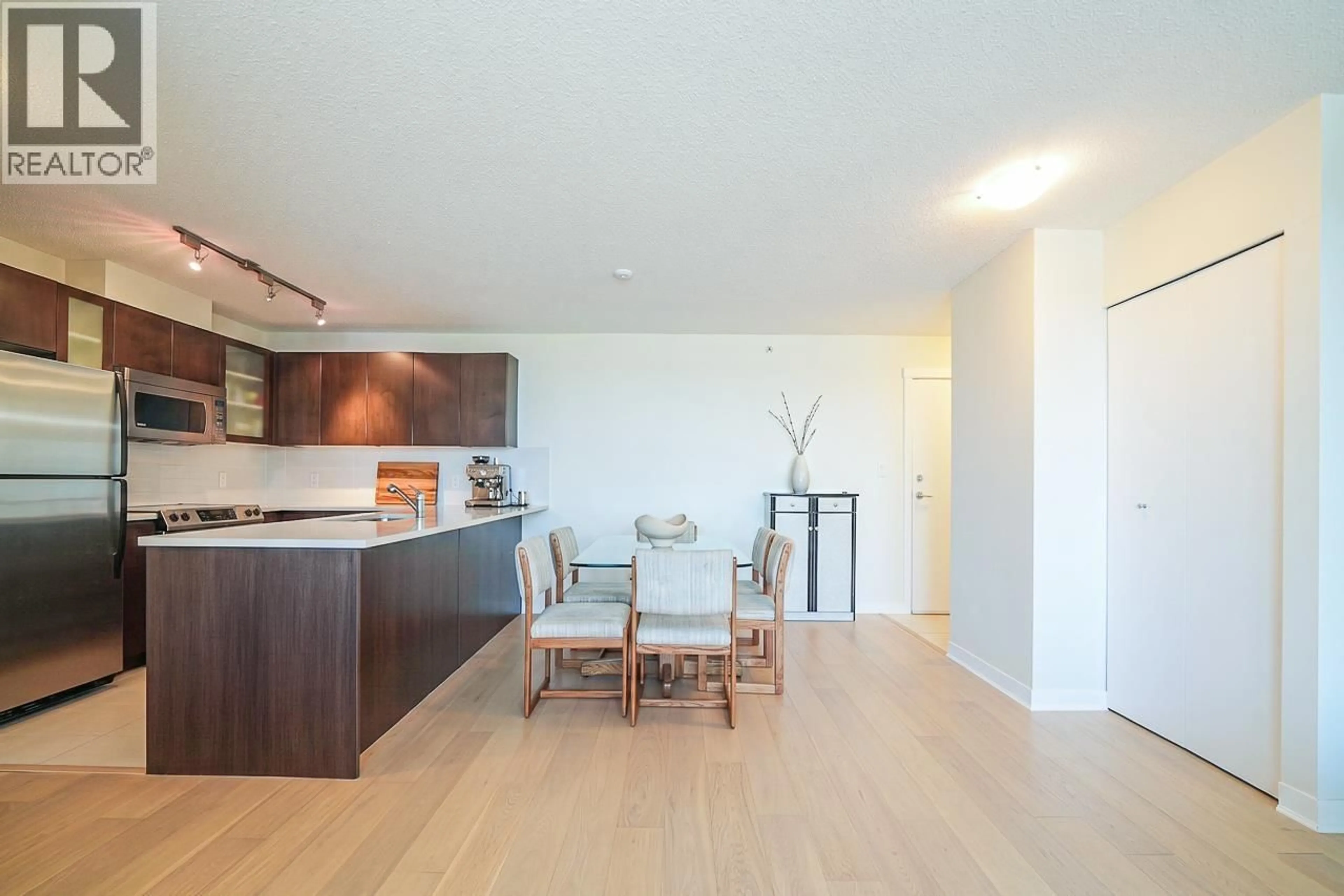 Open concept kitchen, wood/laminate floor for 1301 - 7575 ALDERBRIDGE WAY, Richmond British Columbia V6X4L1